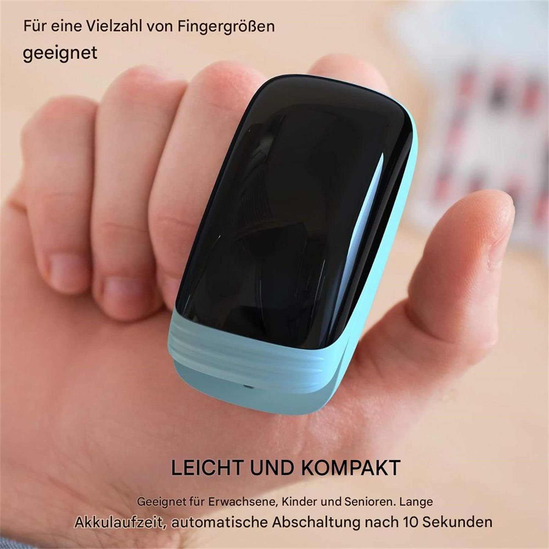 Person hält ein kleines schwarzes und türkisfarbenes Gerät, das einen Finger misst.