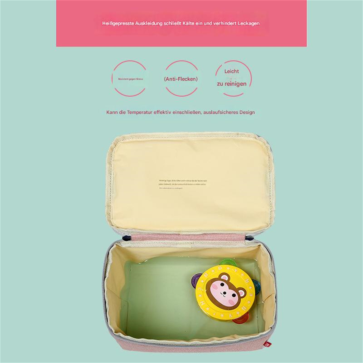 Eine Lunchbox mit einem gelben Spielzeug. Die Box ist rosa und blau.