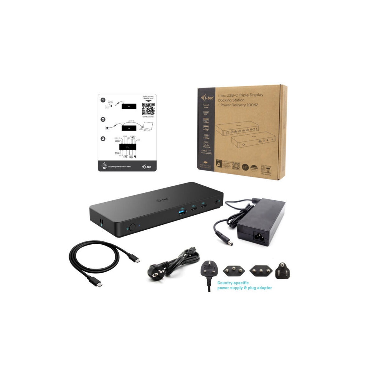 Black USB-C hub with cables, power adapter, and box on white surface.