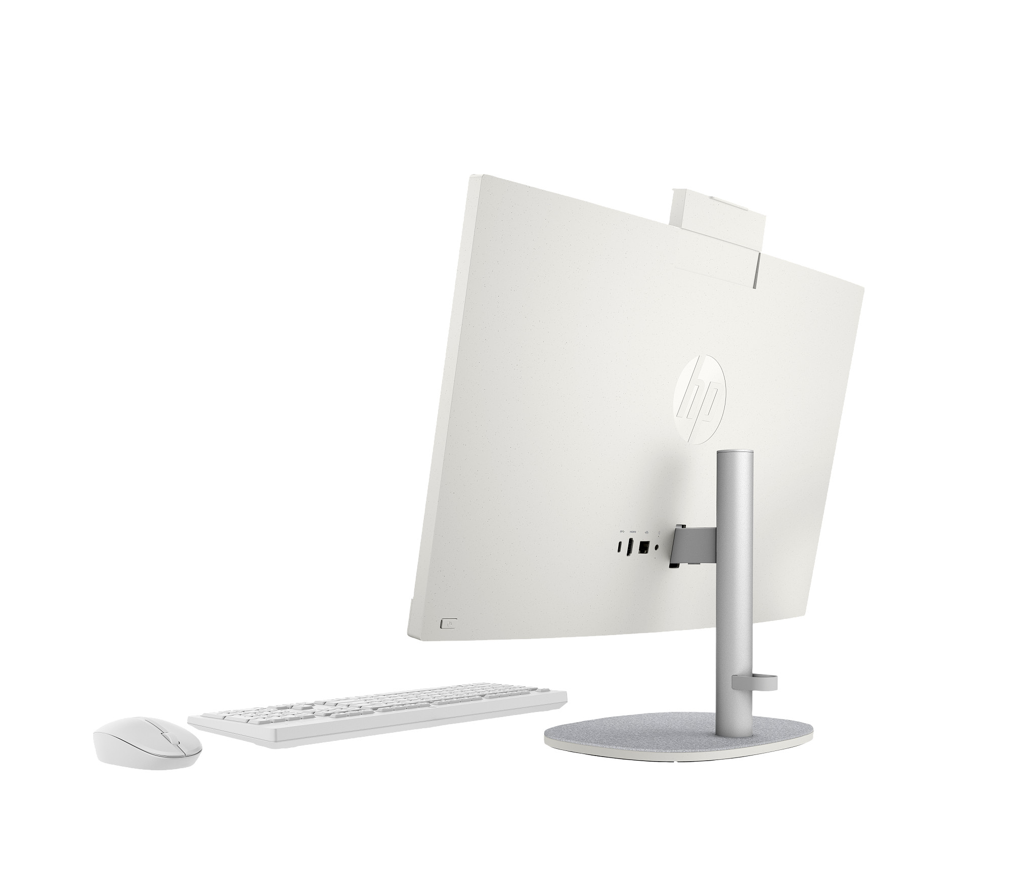 Biały komputer typu all-in-one z tyłu, pokazujący ekran, podstawkę oraz klawiaturę i mysz.