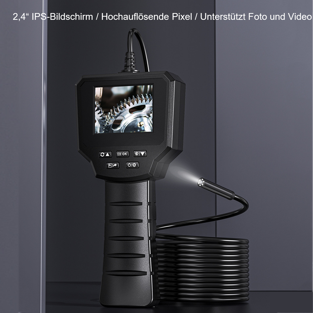 Eine schwarze Endoskopkamera mit Bildschirm zeigt ein Bild von Zahnrädern. Es hat Bedienelemente und ein Licht.