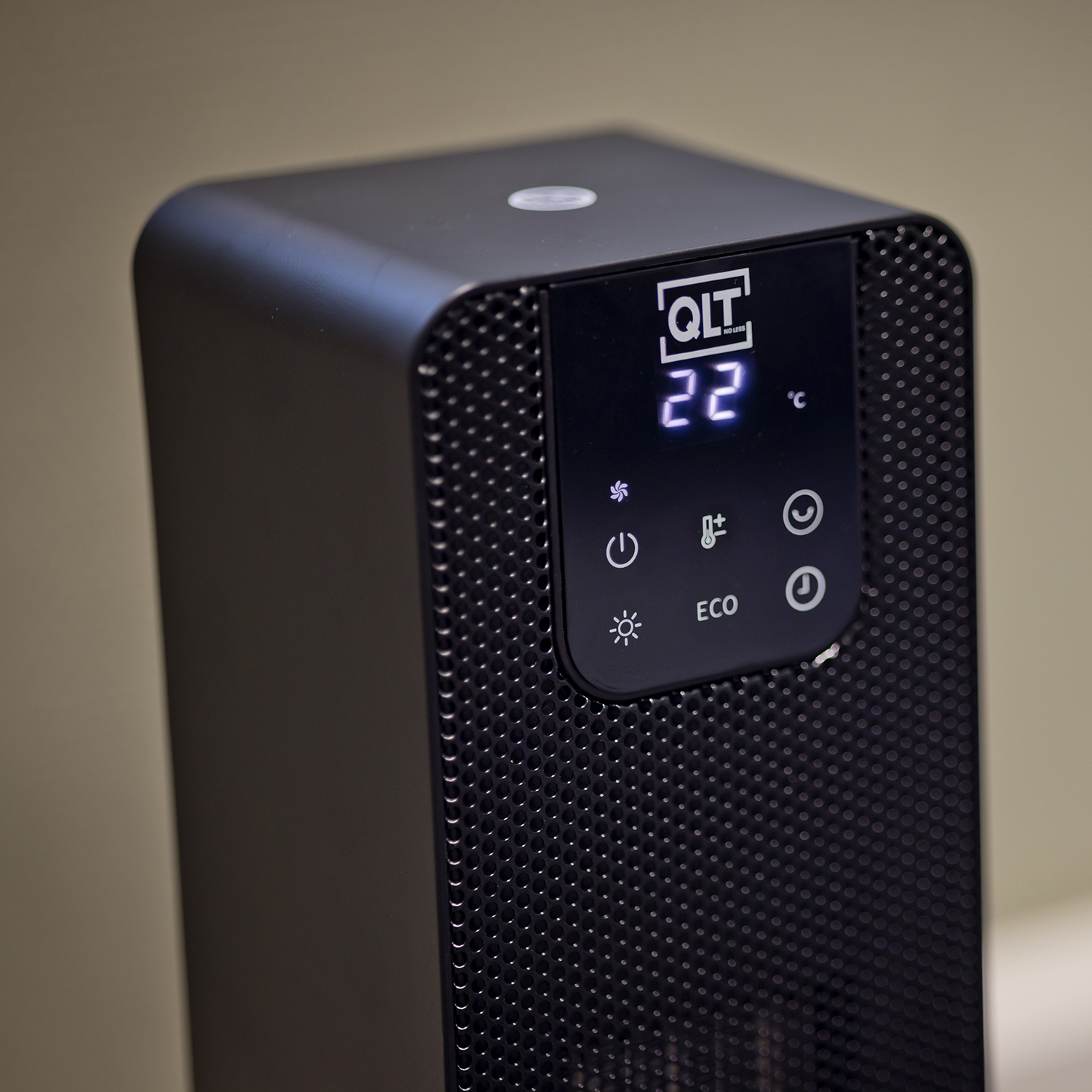 A black QIT heater with a display showing 22 degrees Celsius and control buttons.