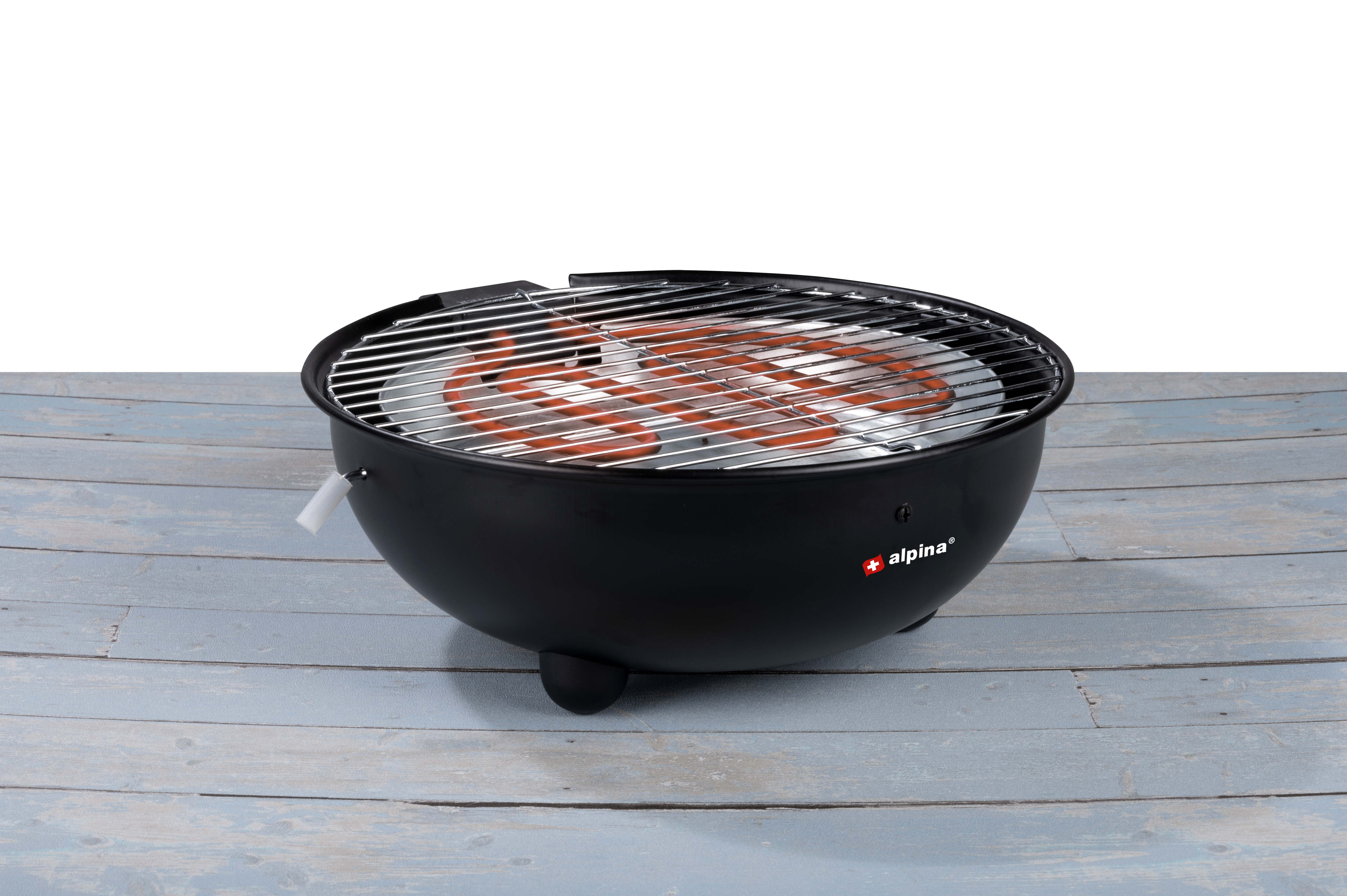 A black electric grill with a red heating element sits on a blue wooden surface. It has a handle.