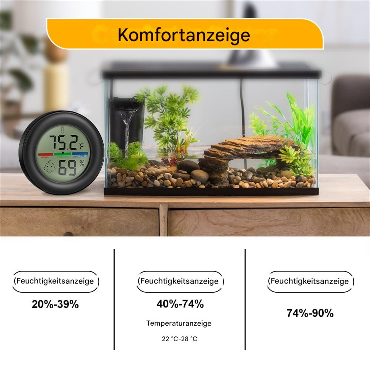 Digitales Thermometer und Hygrometer neben einem Aquarium mit felsigem Aufbau.