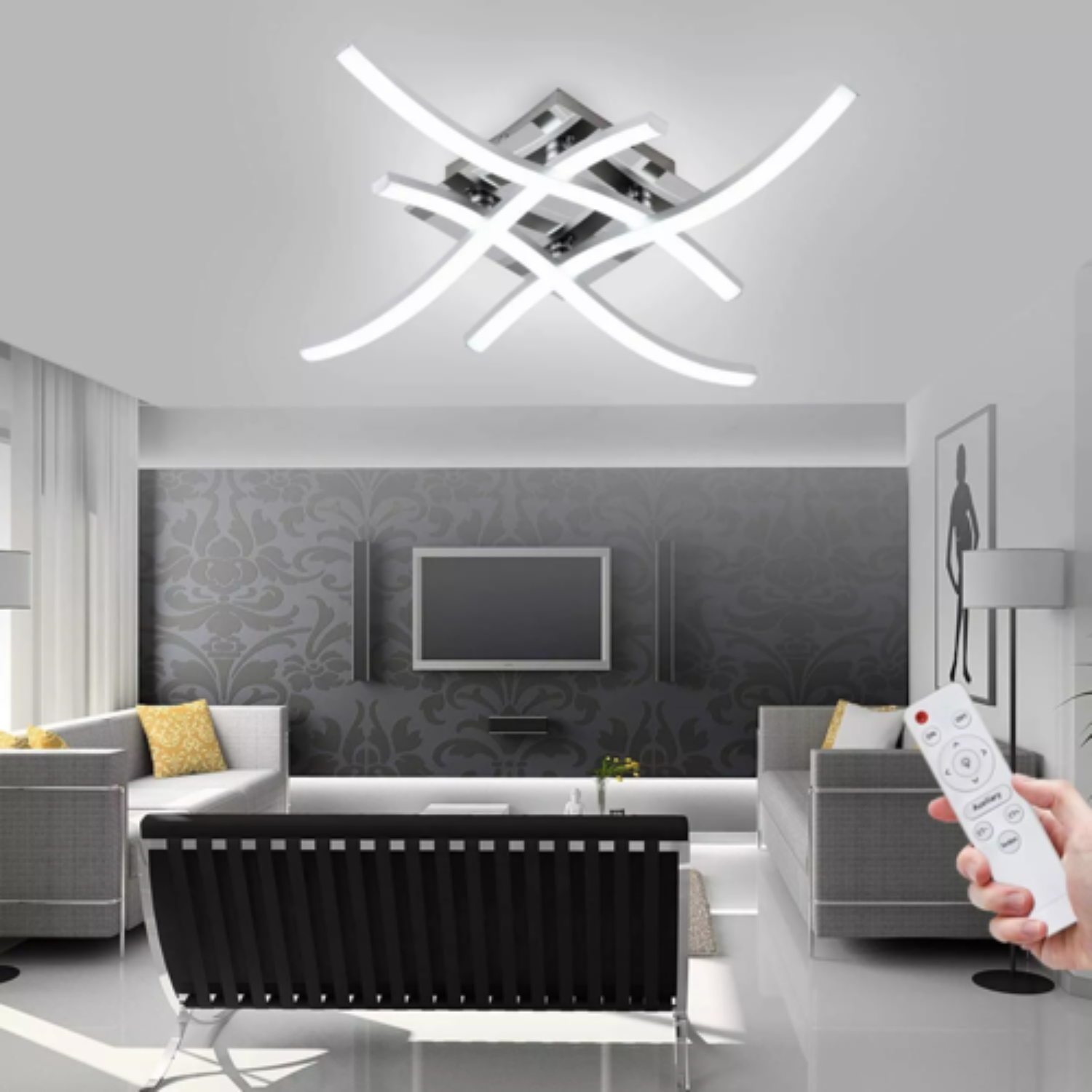 Moderne Deckenleuchte mit geschwungenen weißen Lichtelementen und Fernbedienung.
