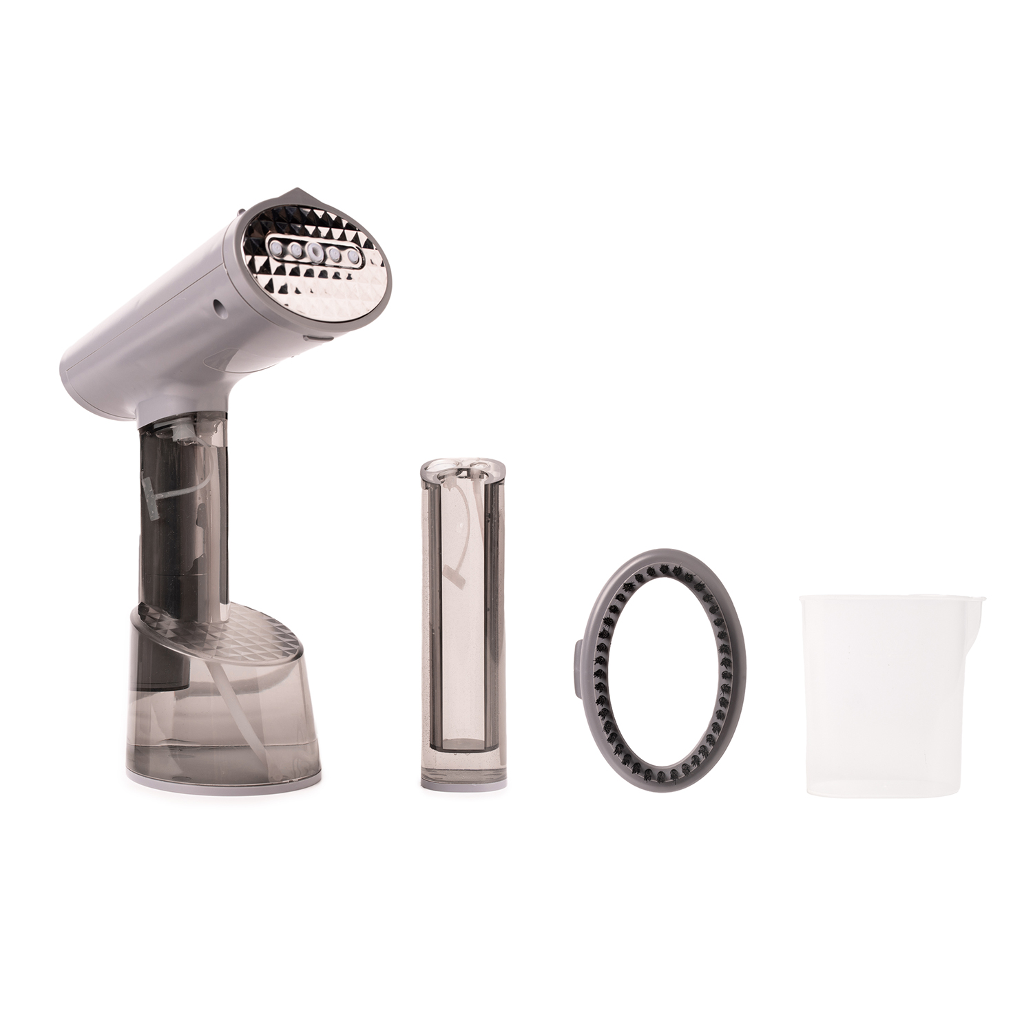 Een gedemonteerde kledingstomer. Inclusief de stomer, een filter, een borstel en een waterbeker.
