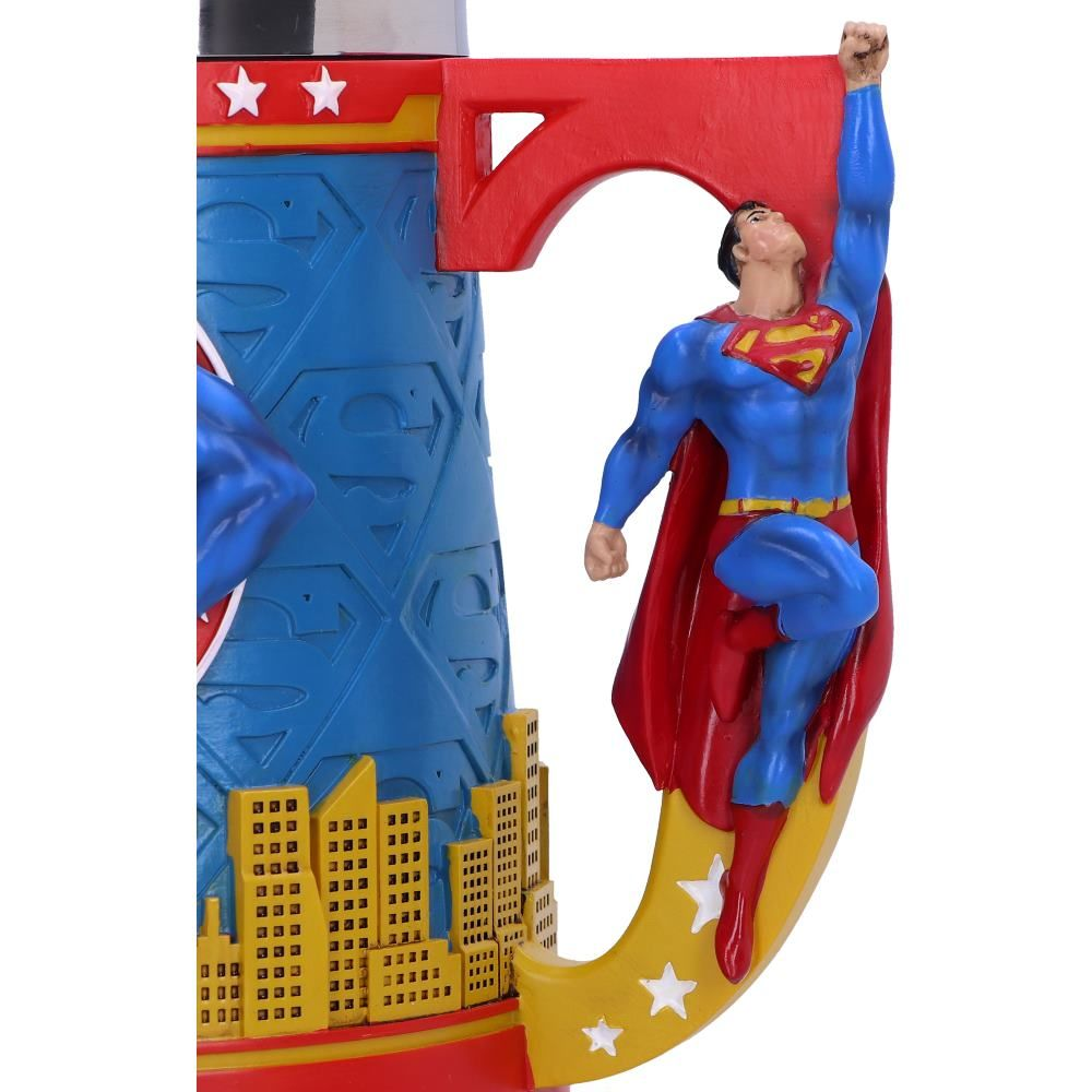 Superman mug with a Superman figure. The mug is blue and red with yellow accents.