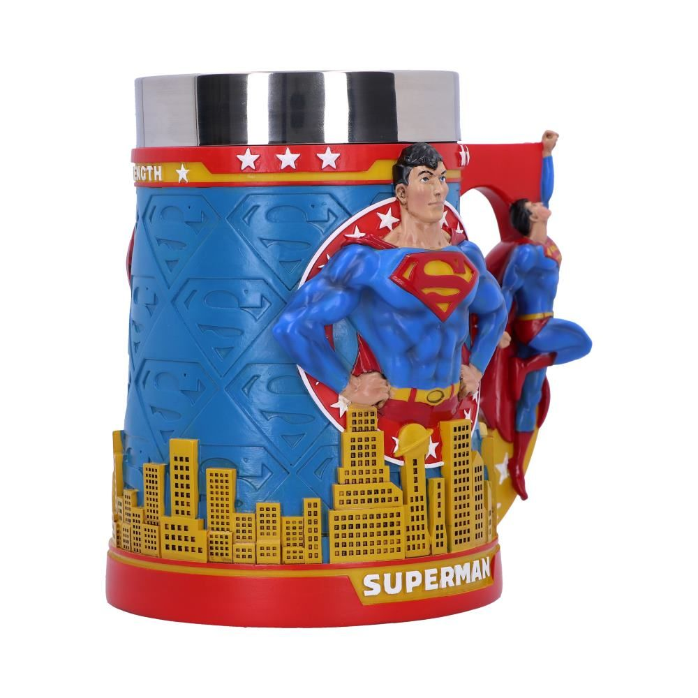 A Superman mug with a cityscape base, Superman figures, and the words: STRENGTH, and SUPERMAN.