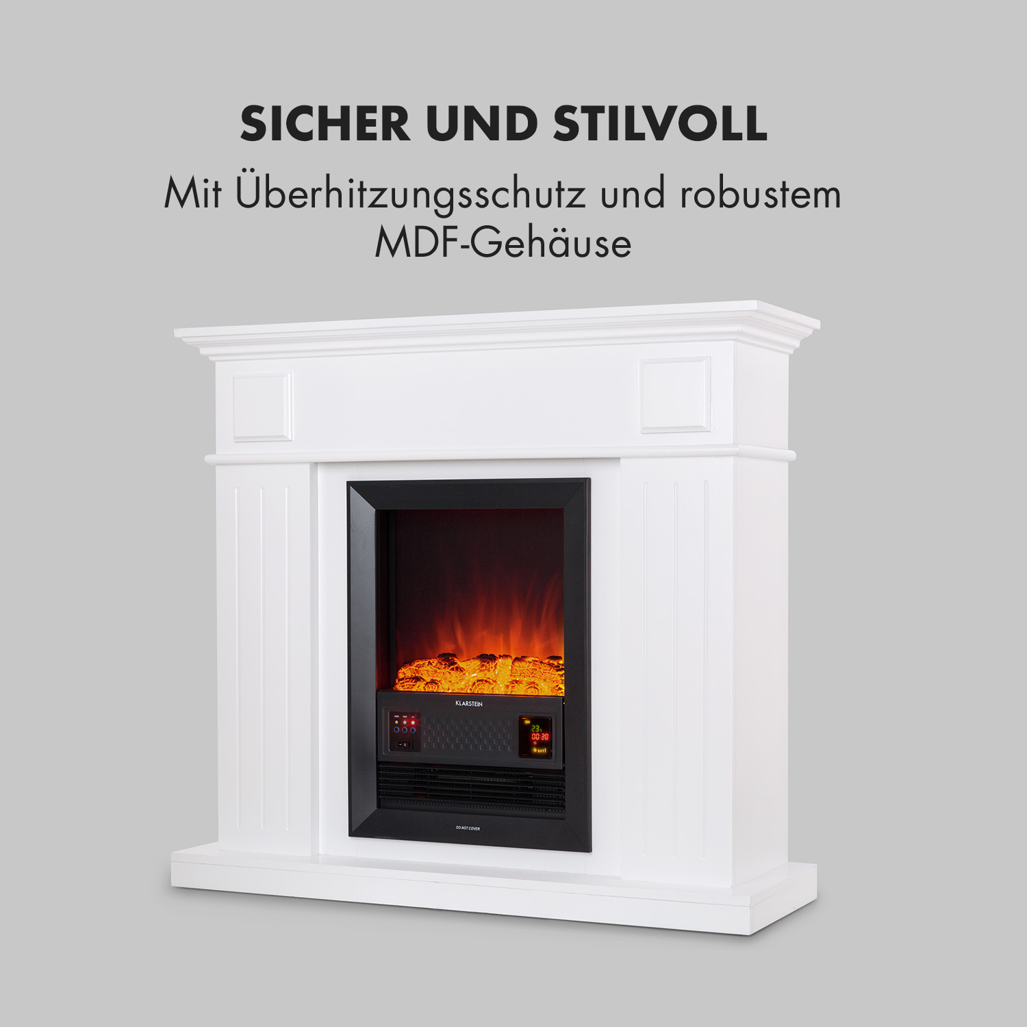 Caminetto bianco con inserto nero con visualizzazione delle fiamme. Testo: 'SICHER UND STILVOLL' e testo sotto.