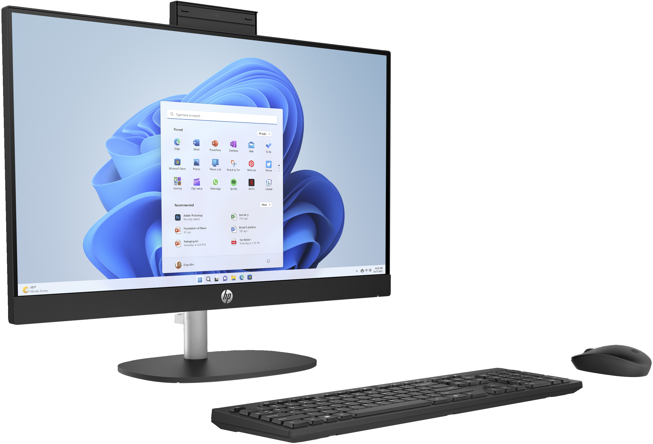 Black HP all-in-one desktop computer with keyboard and mouse, Windows 11 screen.