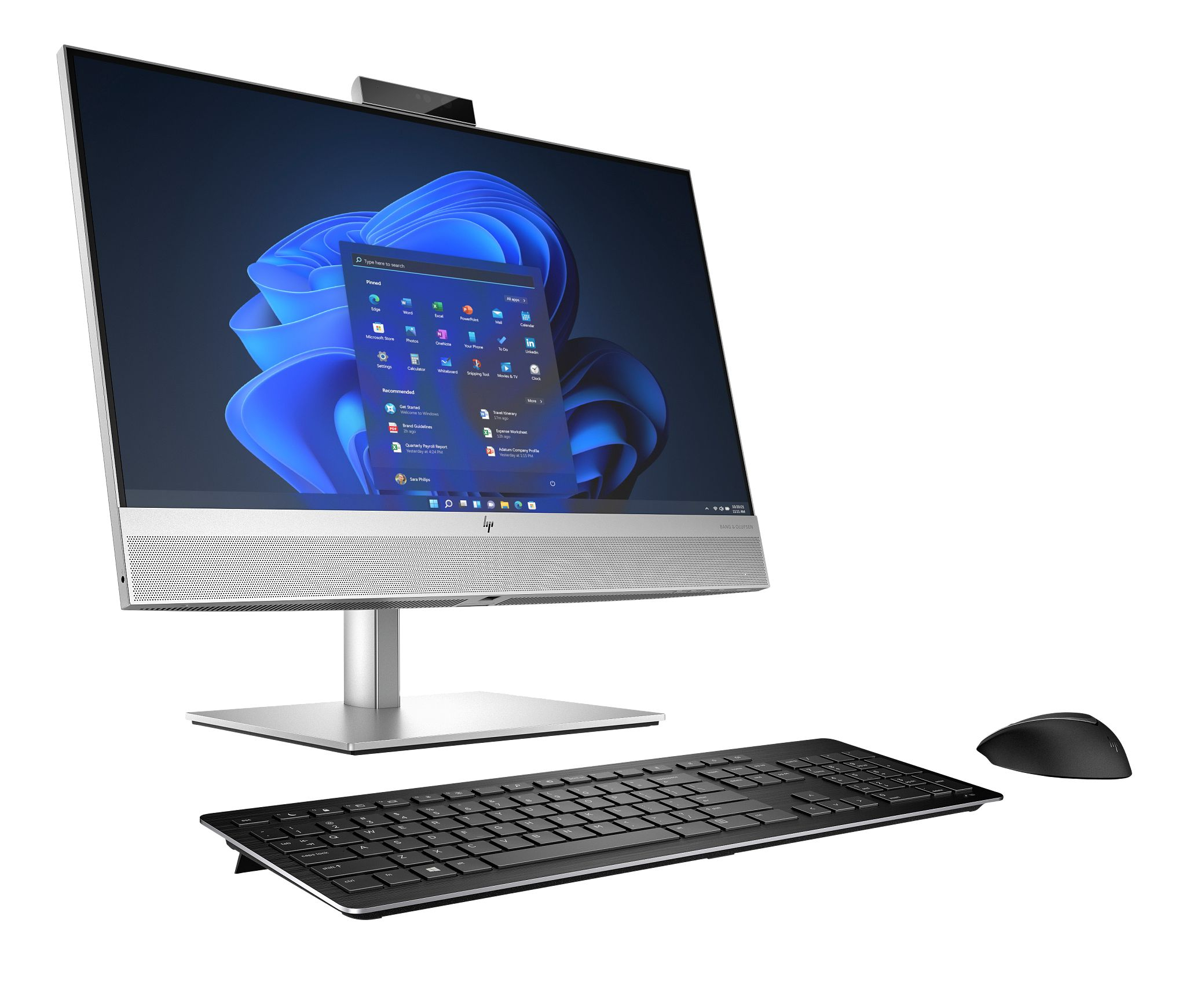 Srebrny komputer HP all-in-one z czarną klawiaturą i myszą. Ekran wyświetla interfejs biznesowy.