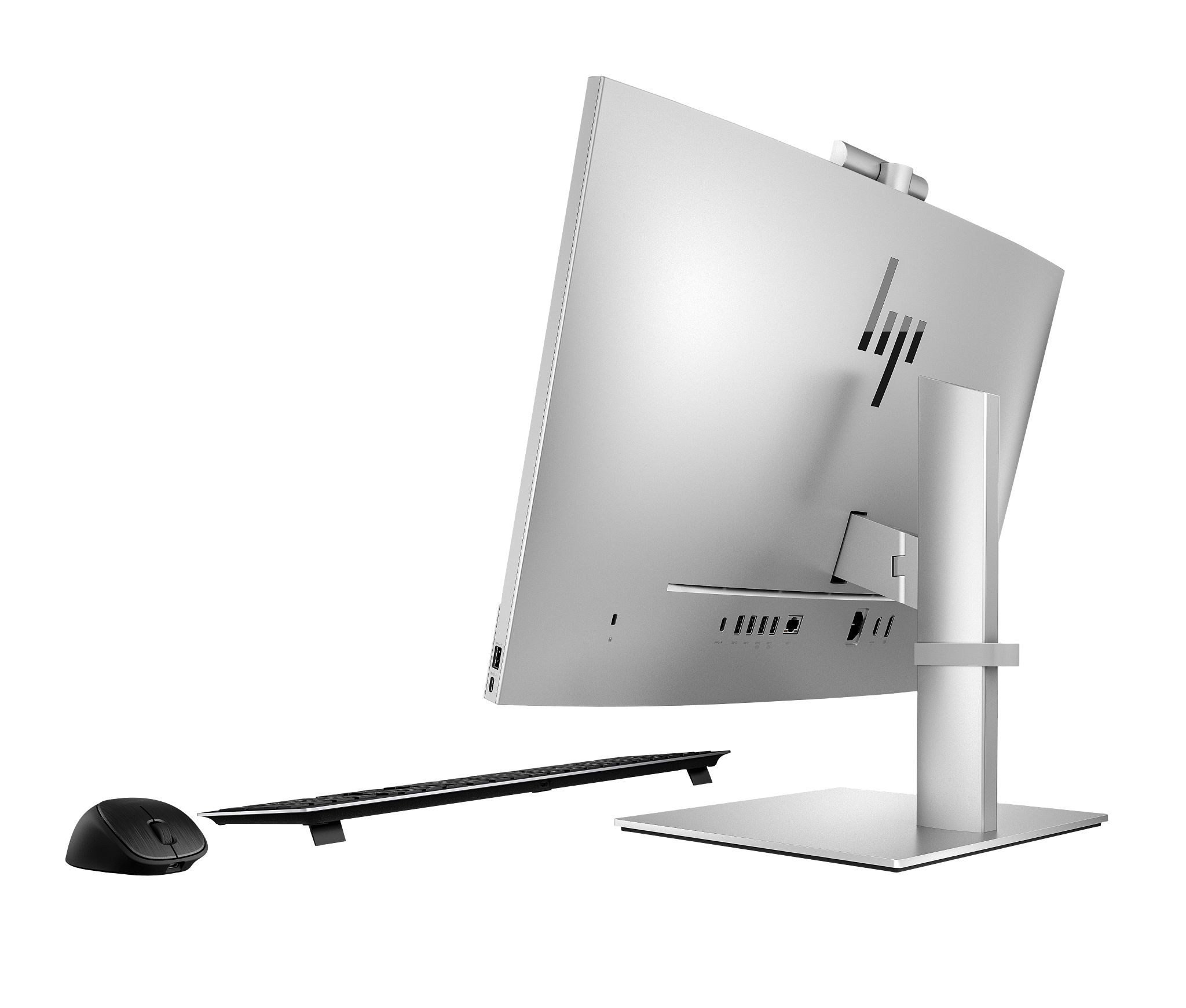 Widok z tyłu srebrnego komputera HP all-in-one, z portami i logo HP.