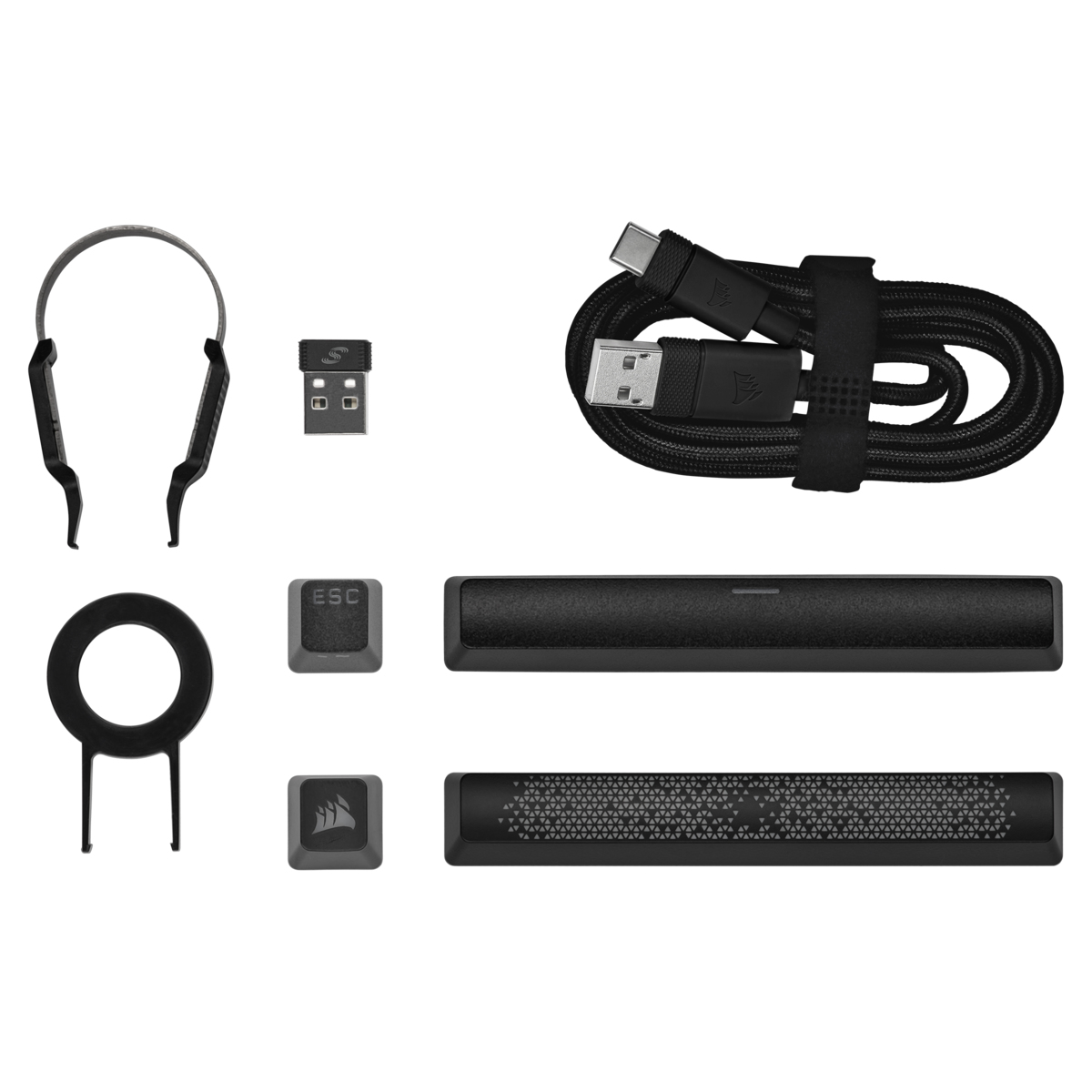 Accessori neri: cuffie, ricevitore USB, cavo USB, tasto e due barre nere.