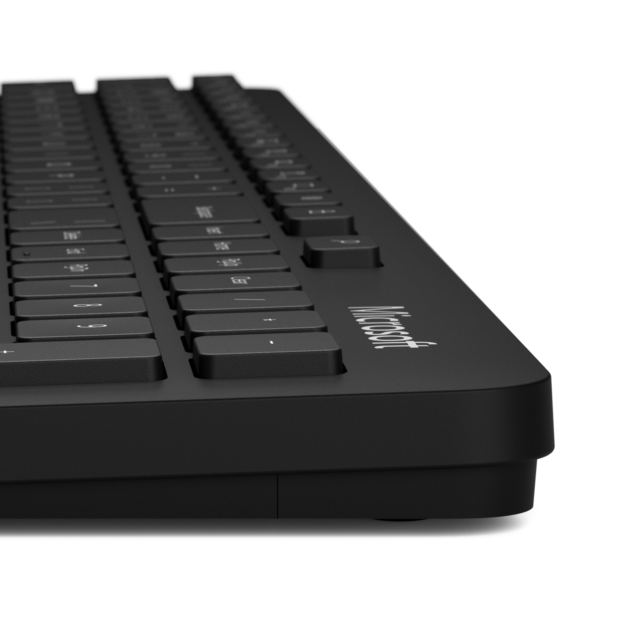Tastiera nera a basso profilo. I tasti e la superficie sono neri. Il logo Microsoft è visibile.