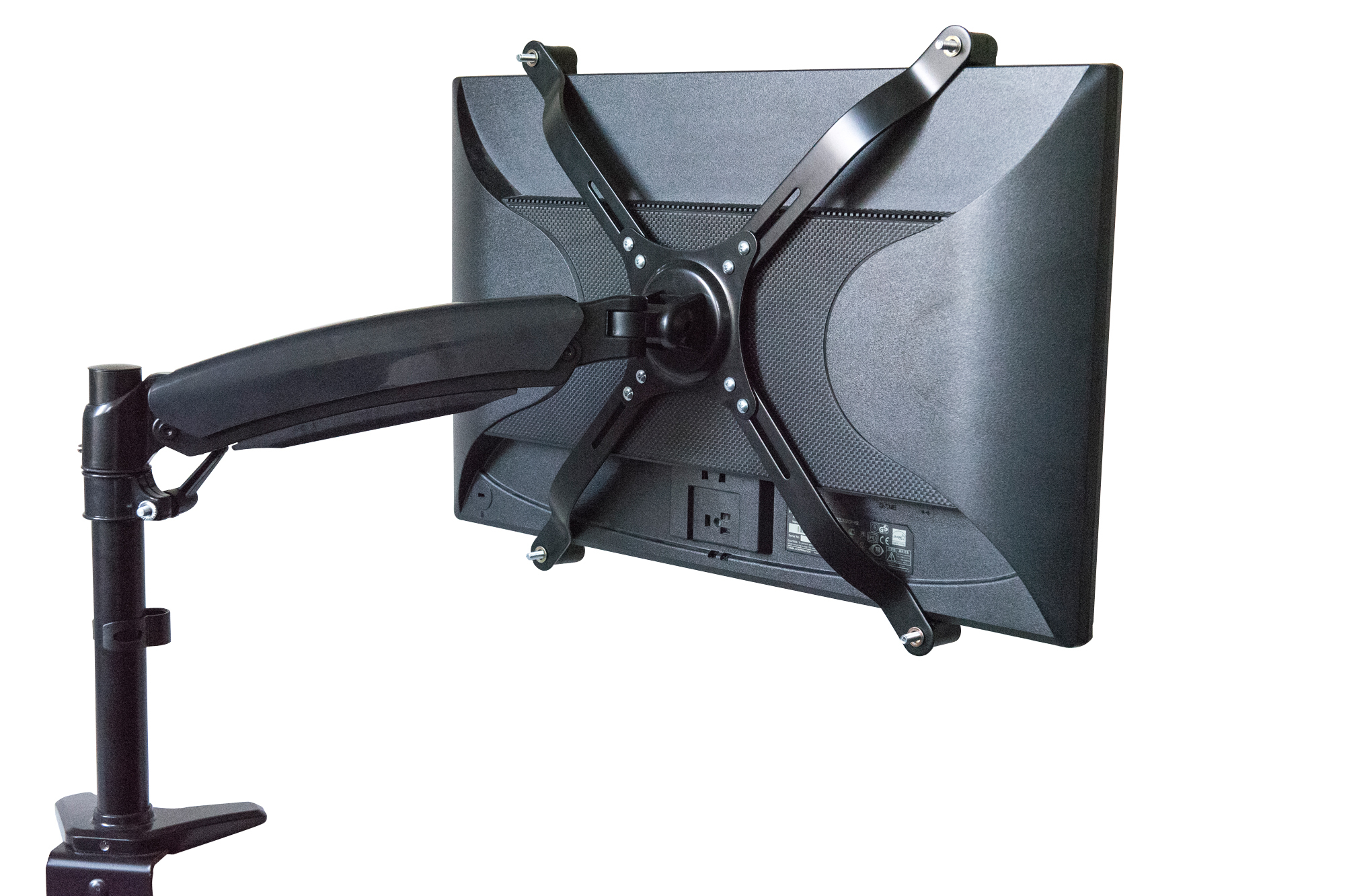 Die Rückseite eines Computermonitors, der an einem schwarzen Ständer befestigt ist. Der Ständer ist an einer weißen Oberfläche befestigt.