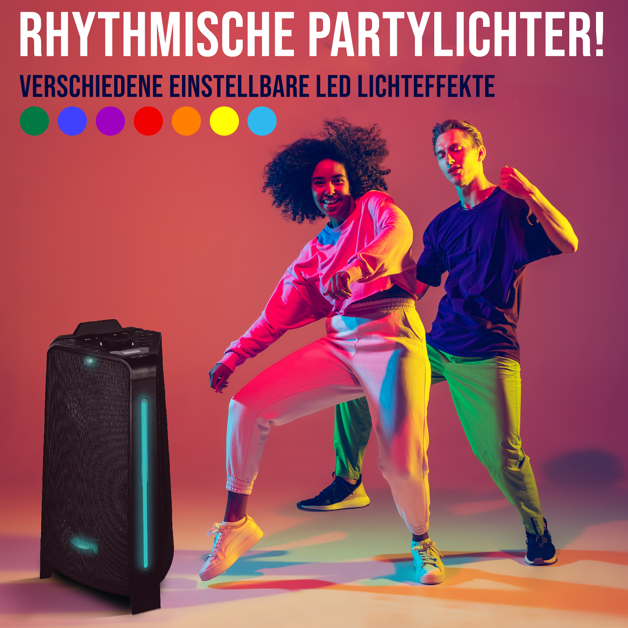 Due persone che ballano davanti a un altoparlante con luci colorate.