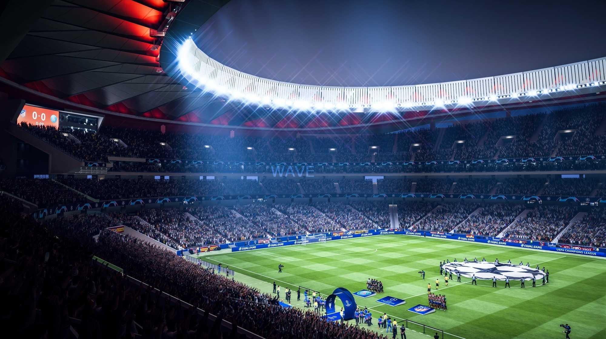 Stadioninnenraum mit Fußballfeld. Großes Publikum, helles Licht und ein Bildschirm mit einem Spielstand von 0:0.