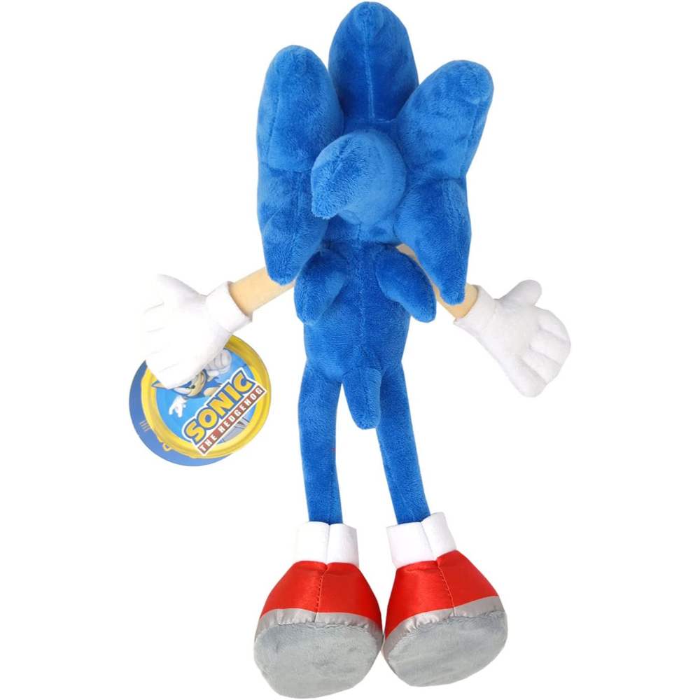 Peluche azul de Sonic the Hedgehog. Está de pie. Guantes blancos, zapatos rojos.