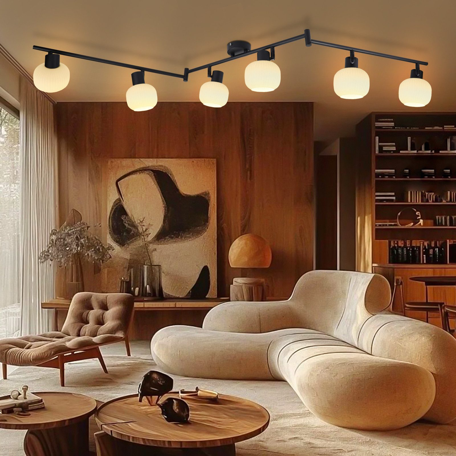 Scena w salonie z nowoczesną lampą sufitową i zakrzywioną beżową sofą.