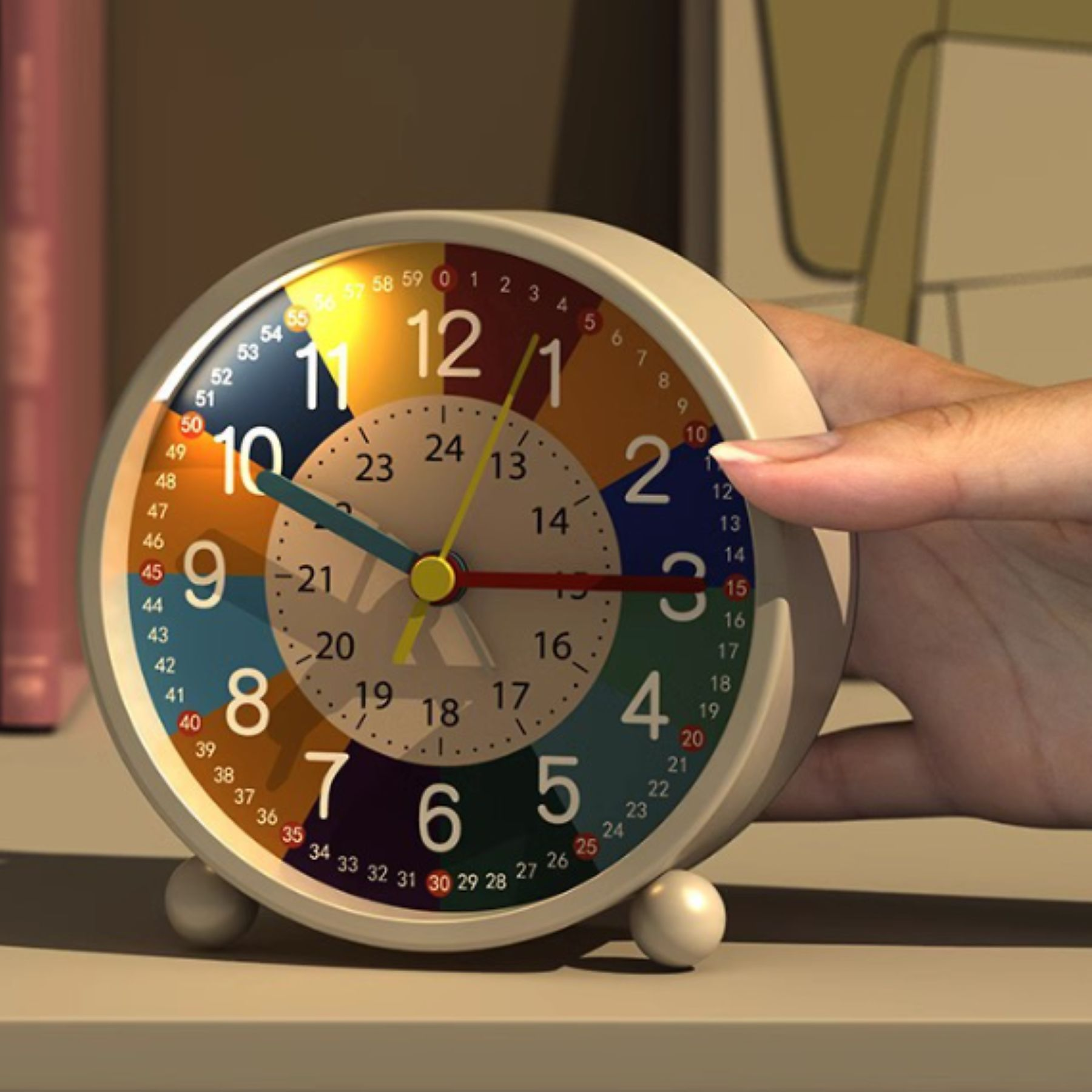 Eine bunte Uhr mit einer Hand, die darauf zeigt, die auf einer Oberfläche ruht.