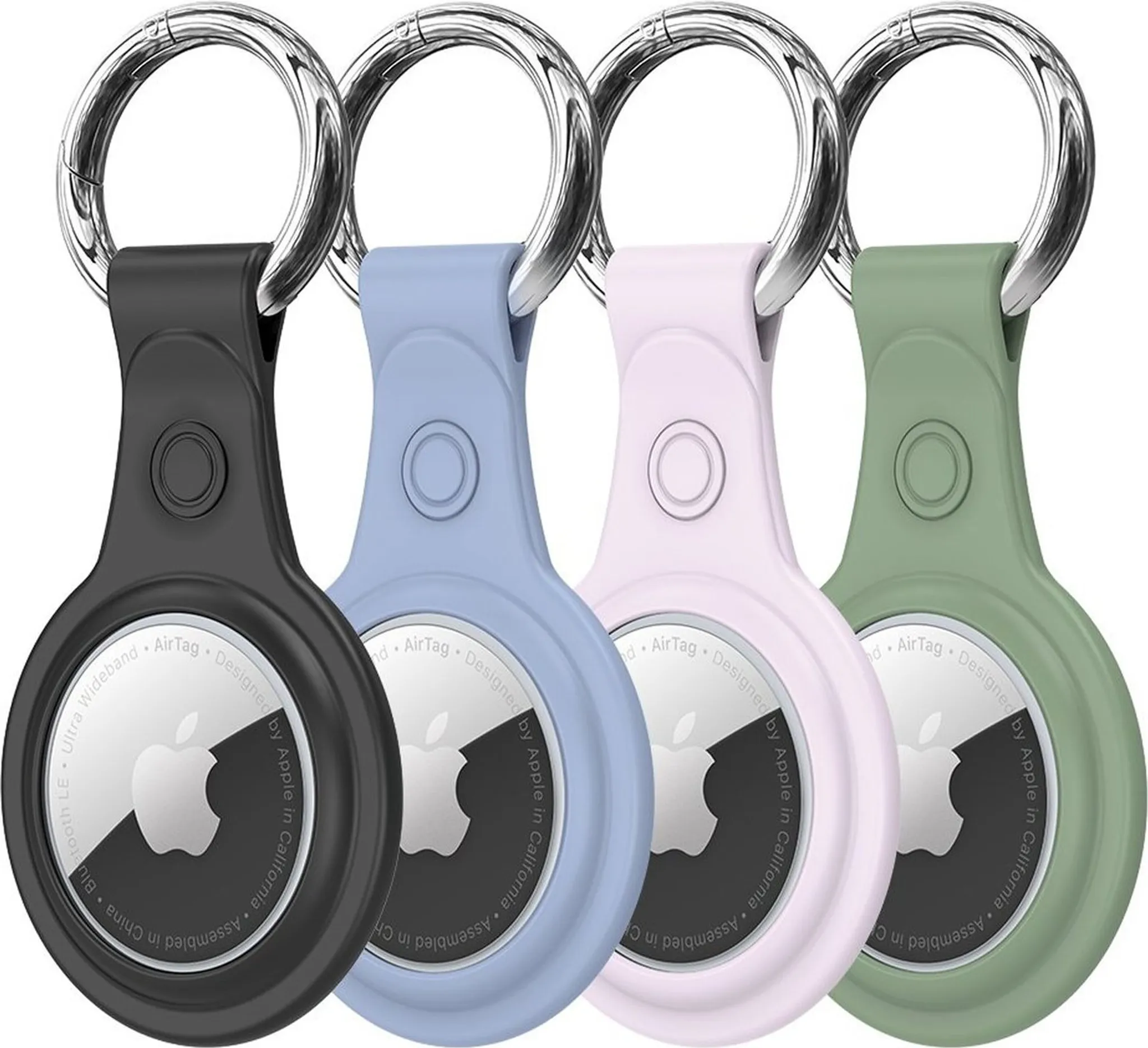 Vier AirTag-Schlüsselanhänger in Schwarz, Blau, Rosa und Grün, jeweils mit Silberring, auf Weiß.