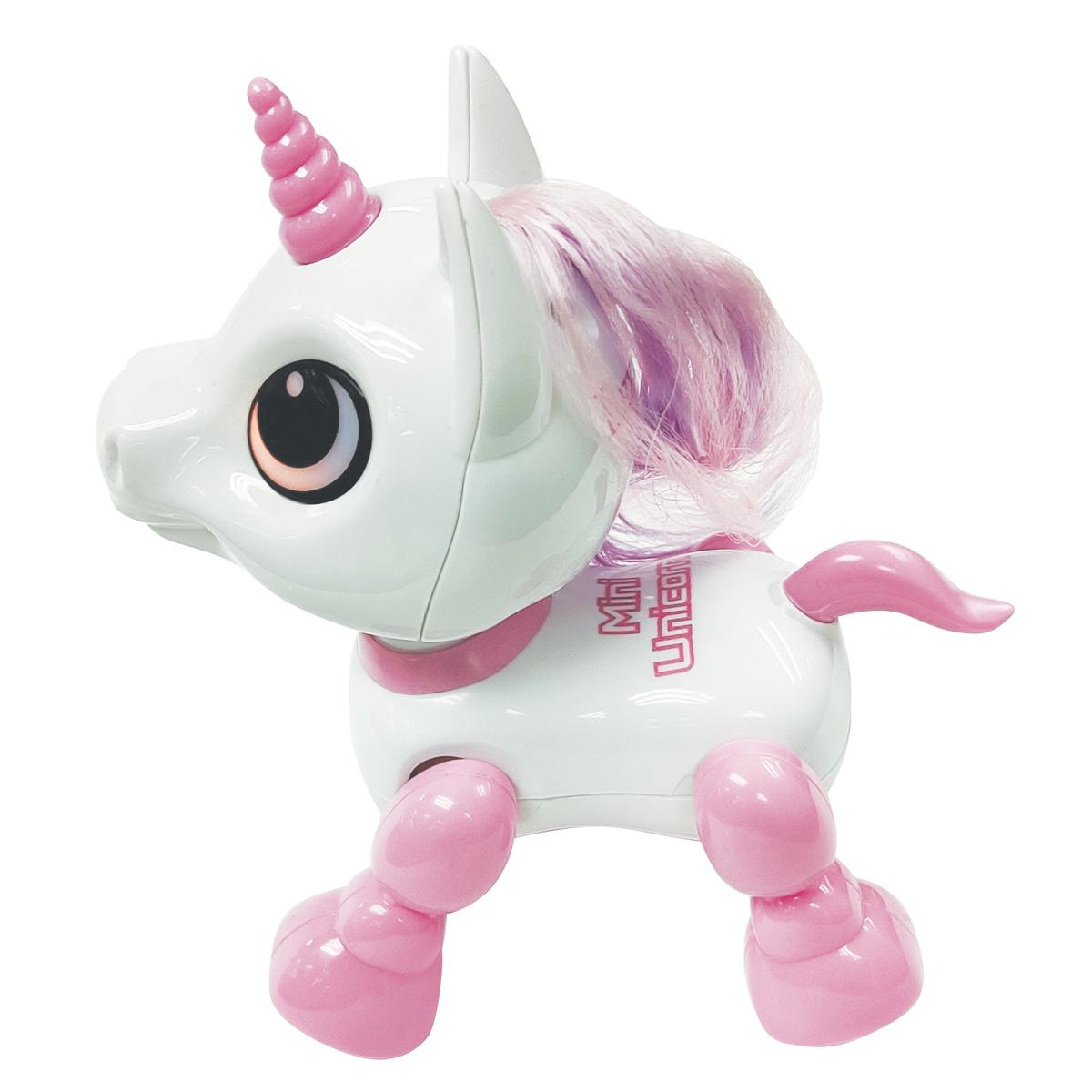 Unicornio de juguete blanco y rosa con melena y cola rosa de pie.