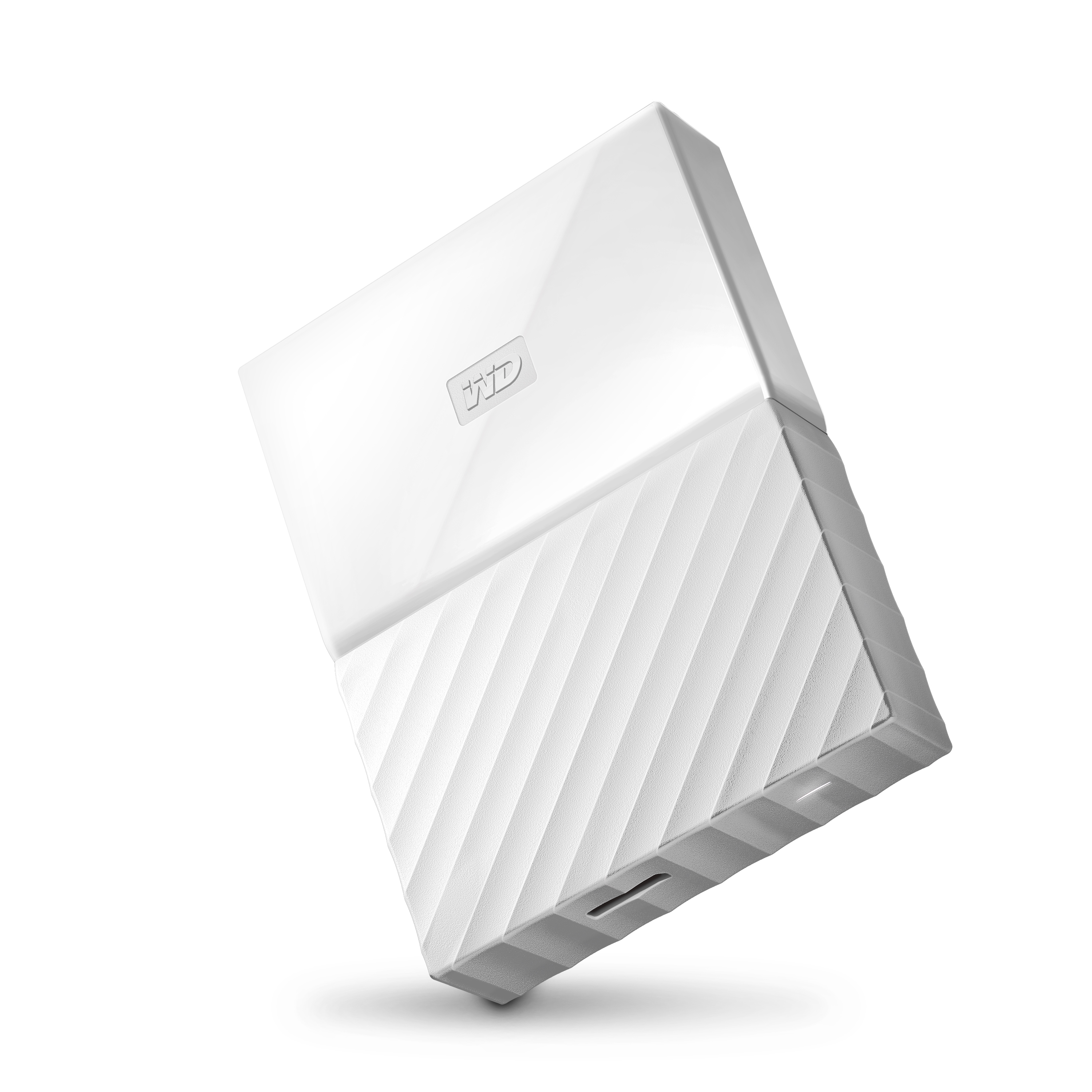 Biały przenośny dysk twardy z teksturowanym wzorem. Posiada port USB i wypukłe logo Western Digital.