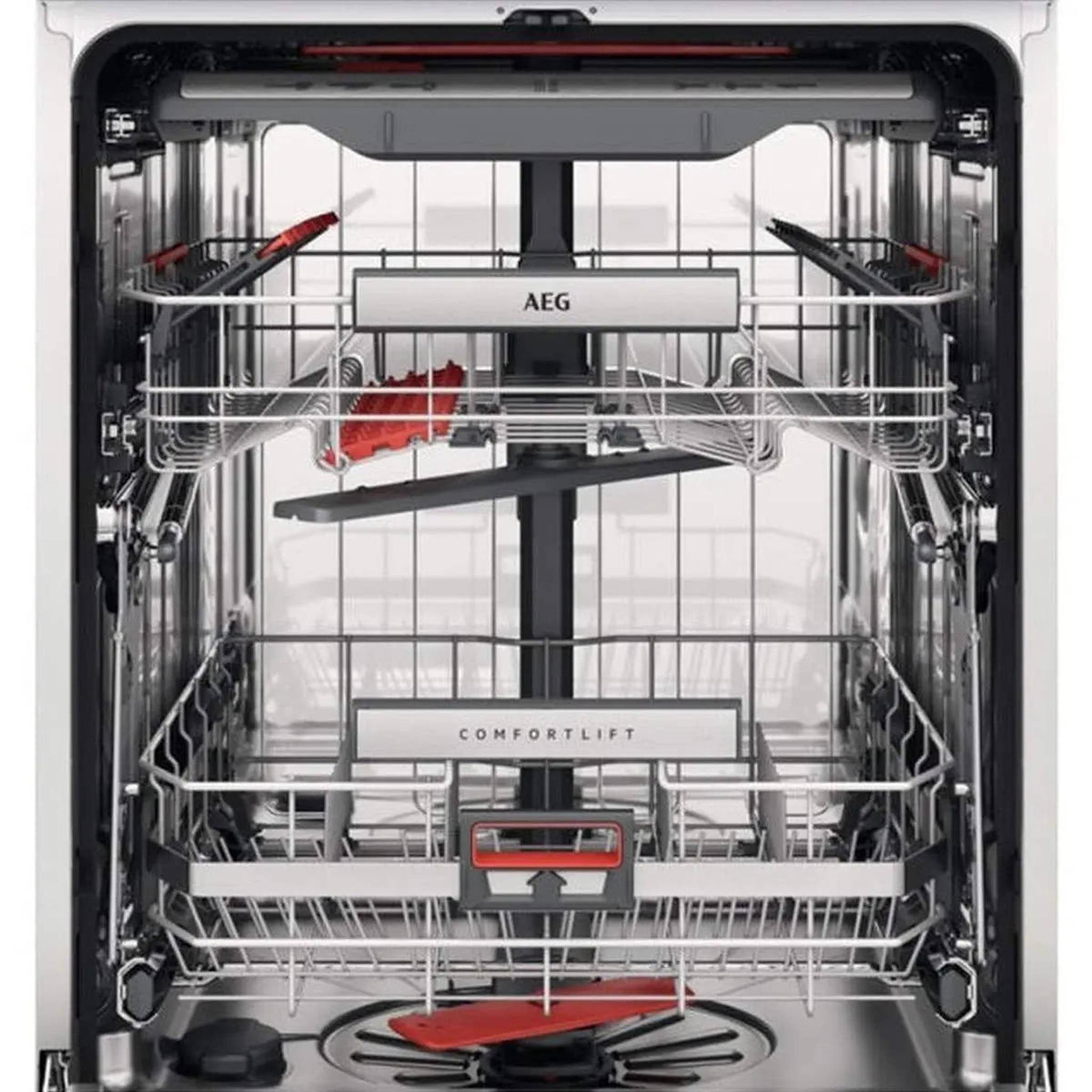 Intérieur de lave-vaisselle, vide. Paniers et bras de lavage visibles.