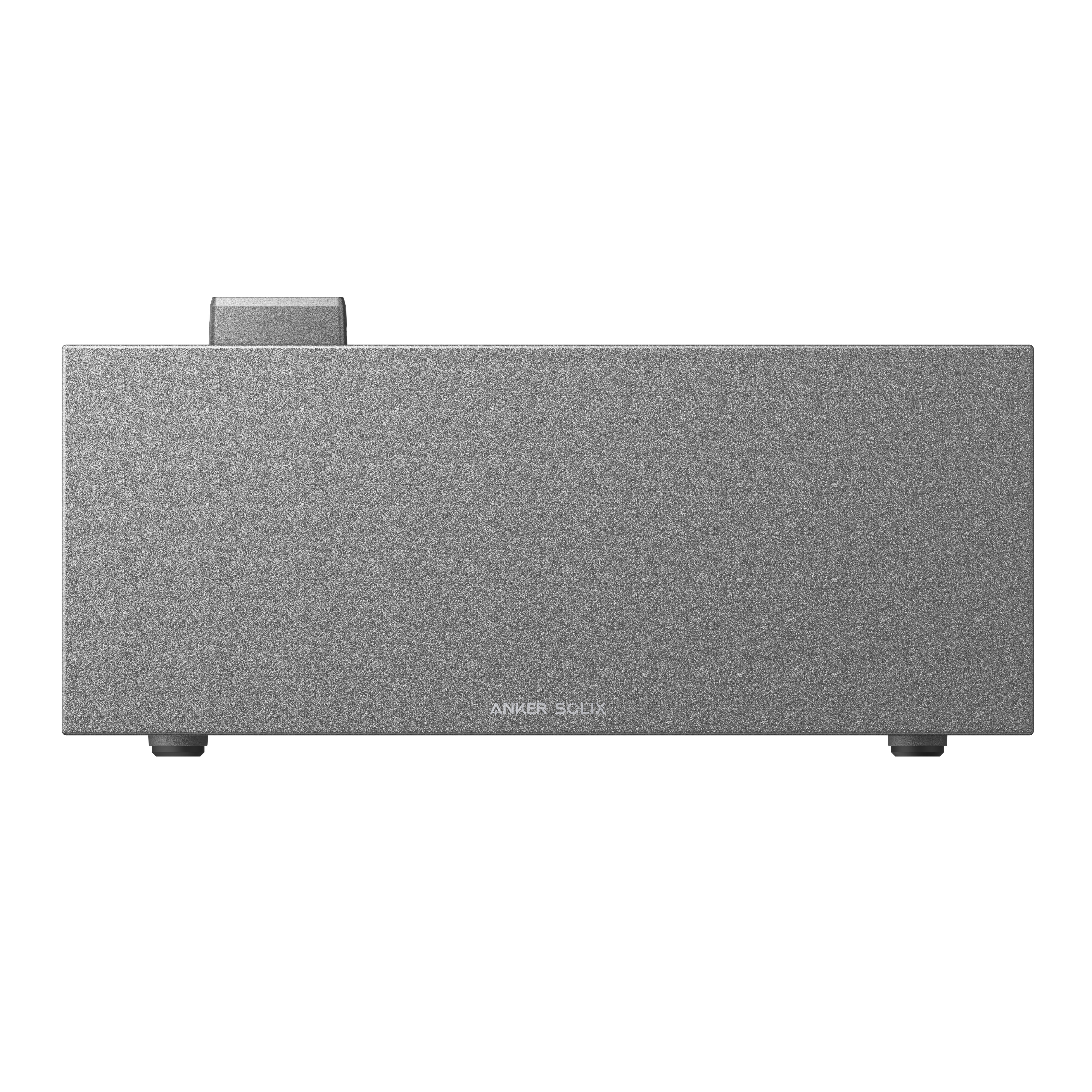 Szare urządzenie Anker Solix. Ma prostokątny kształt z małym przyciskiem na górze.