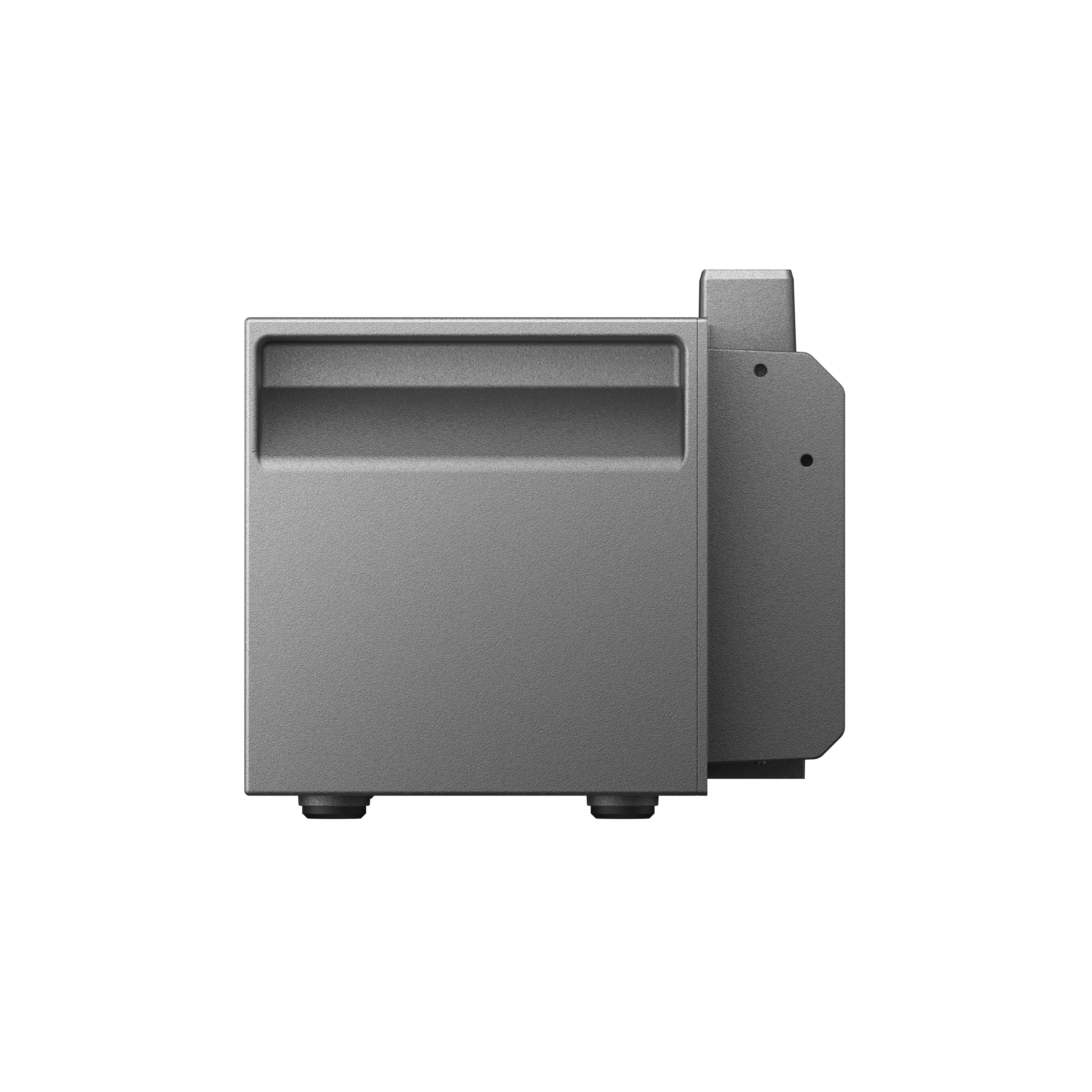 Małe, szare urządzenie pokazane z boku. Jest kwadratowe i ma cechę przypominającą uchwyt.