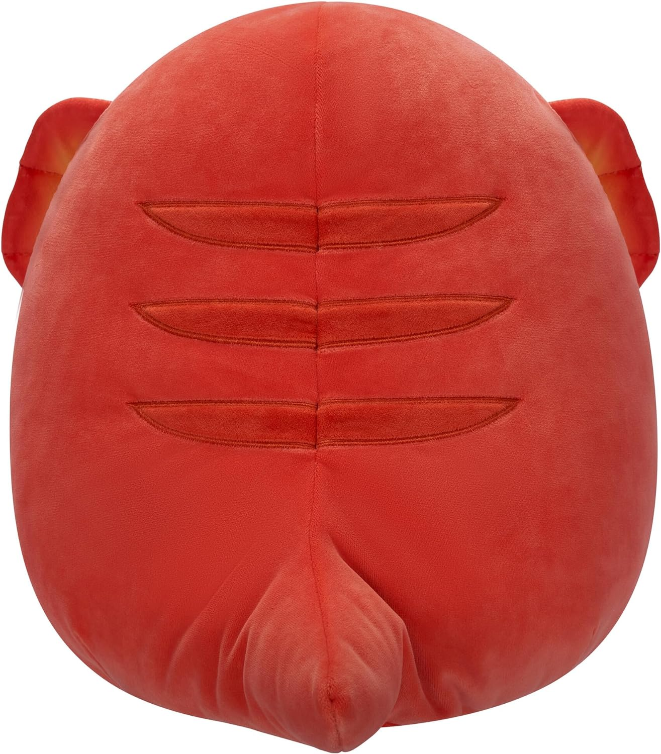 Un grande peluche mostro rosso con una coda e tre strisce.