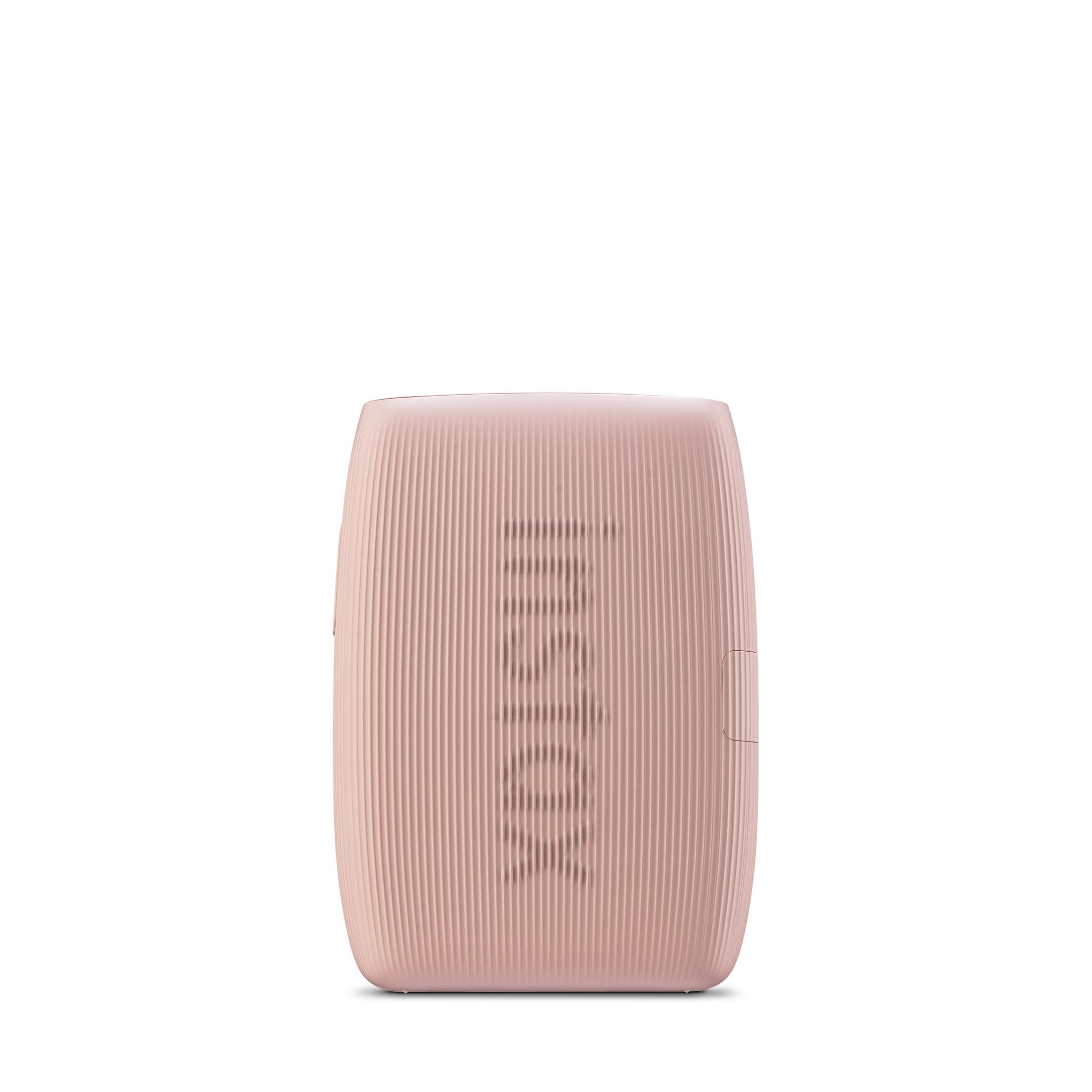 Un altoparlante rosa con creste verticali e la parola 'STOCKWELL' visualizzata verticalmente sulla parte anteriore.