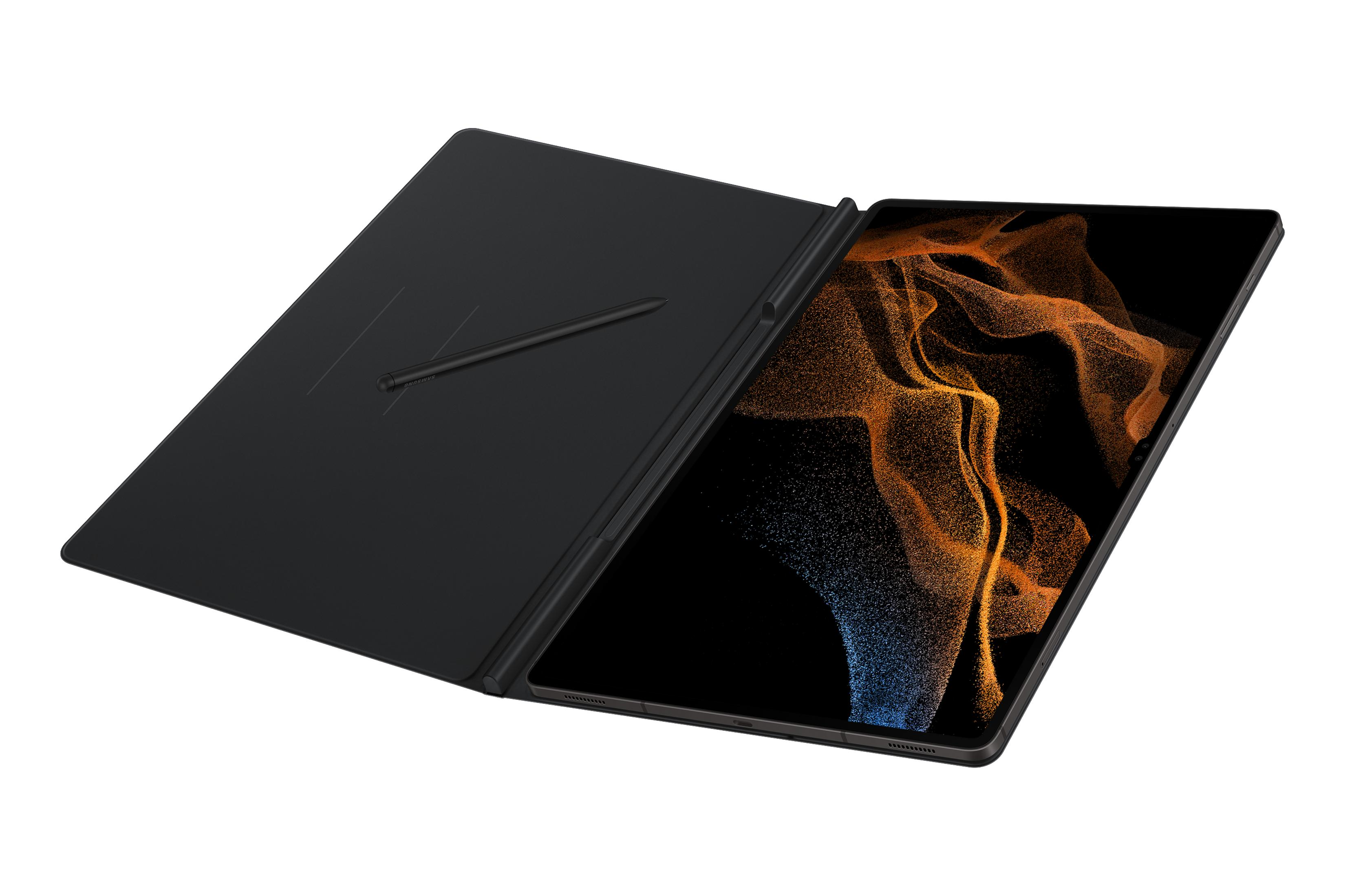 Una tableta con funda y lápiz óptico negros. La pantalla muestra un diseño abstracto naranja y azul.