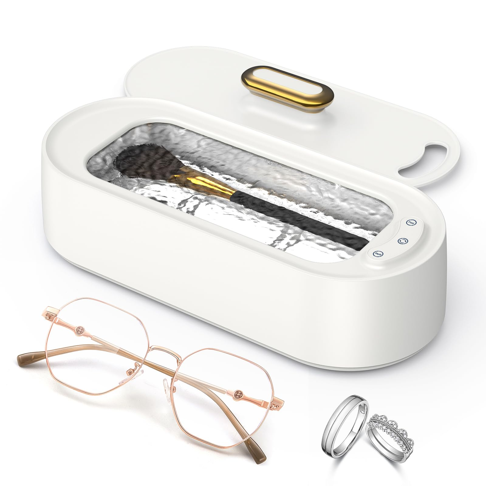 Weißes Reinigungsgerät mit offenem Deckel, Make-up-Pinsel, Brille und zwei Ringen.