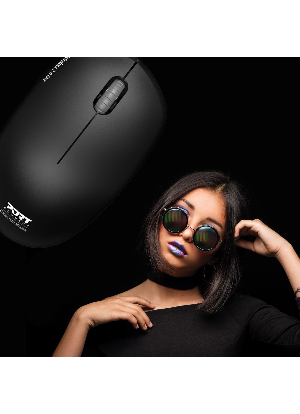 Woman with sunglasses and a mouse. Black background.