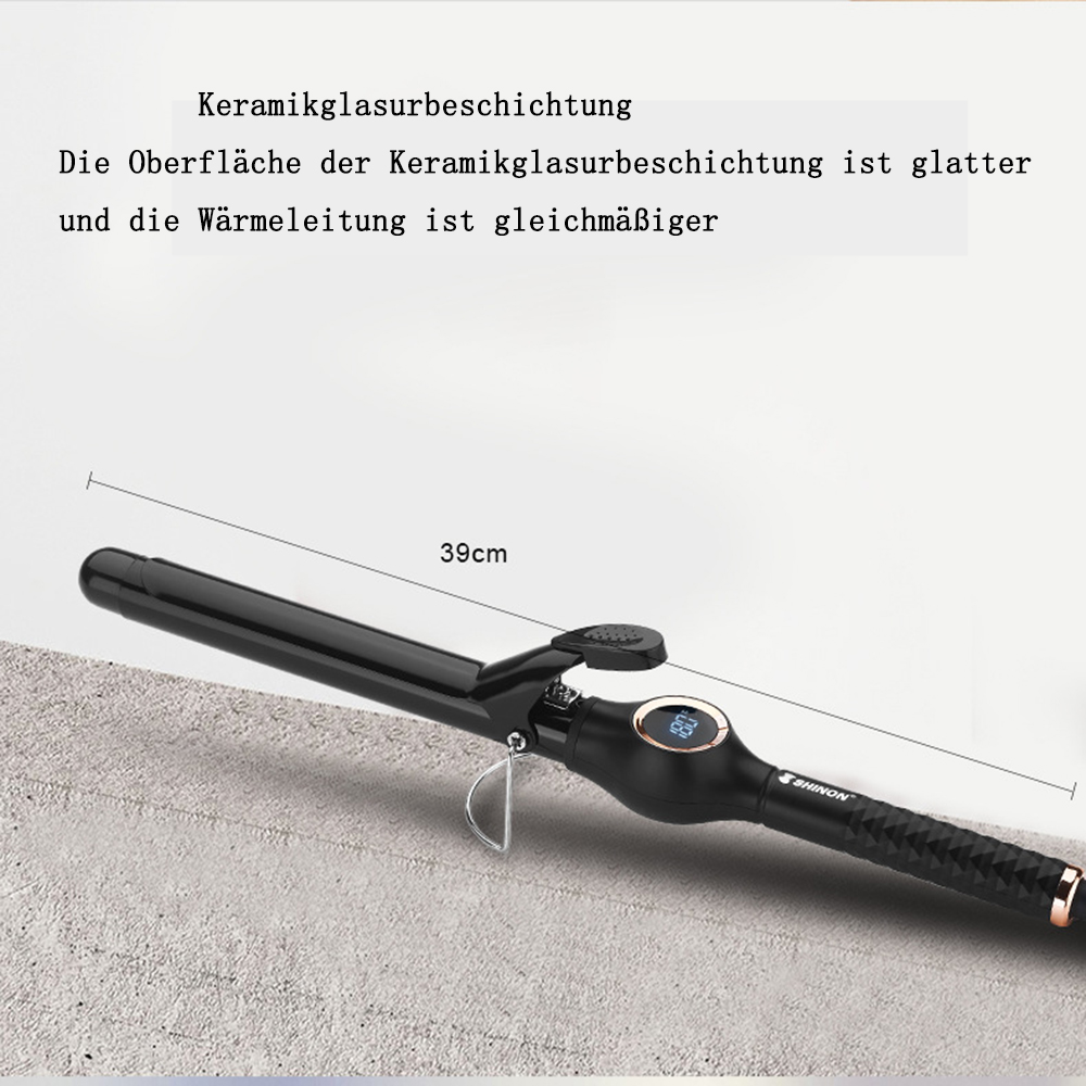Ein schwarzer Lockenstab mit Digitalanzeige 63, auf grauer Oberfläche, mit Text darüber.