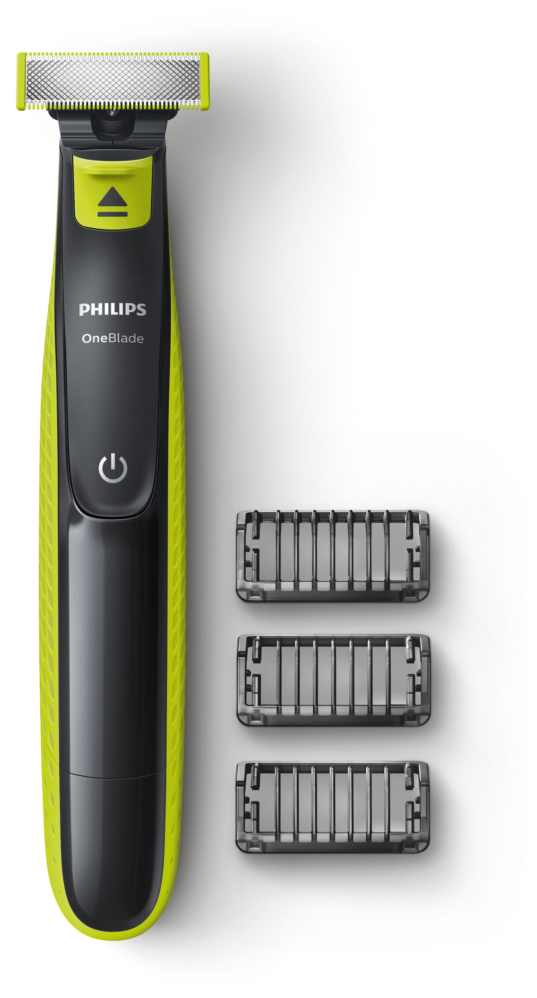 Siyah ve kireç yeşili bir Philips OneBlade tıraş makinesi ve üç adet düzeltme eki. Arka plan beyazdır.