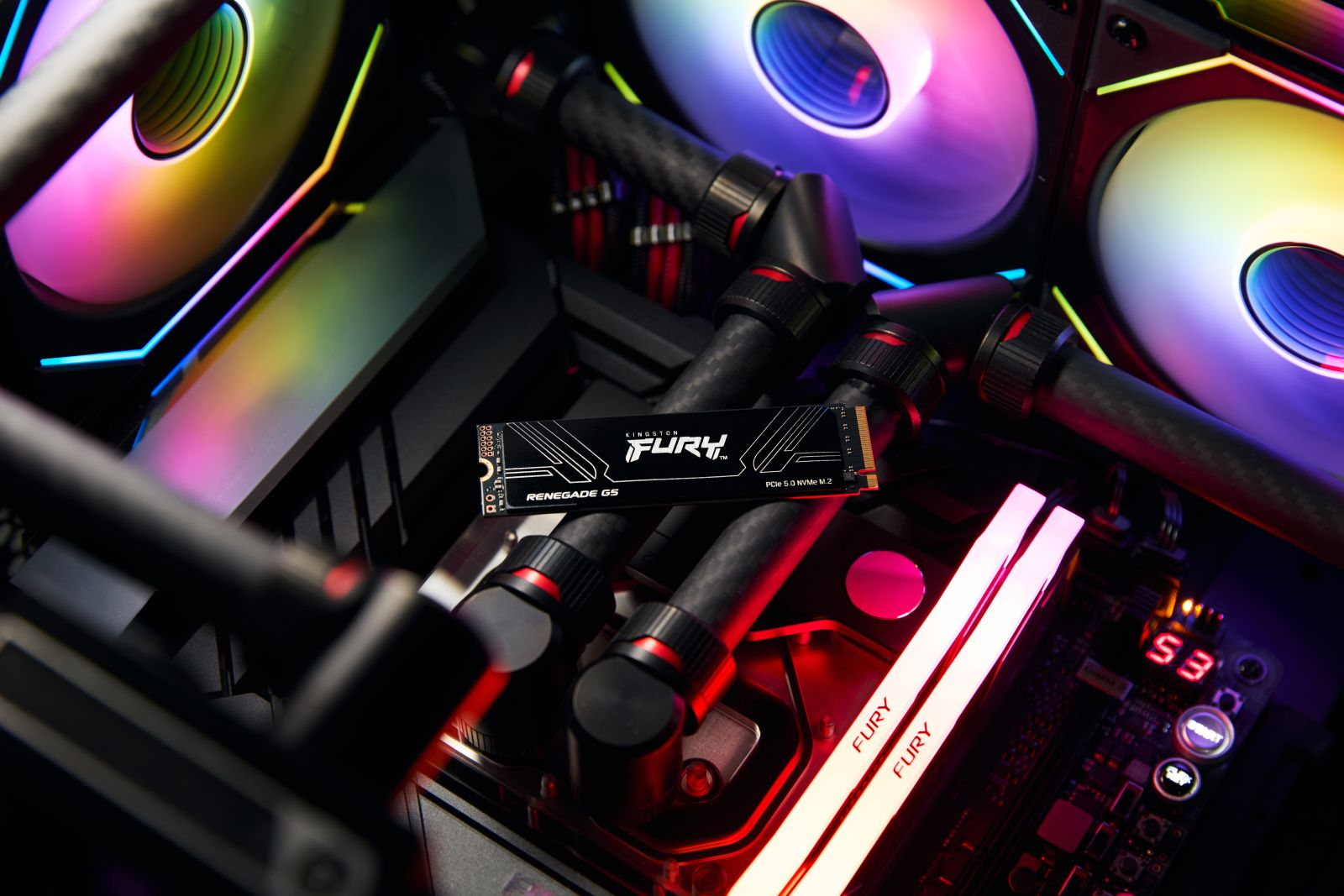 Komponent komputera na płycie głównej z kolorowymi światłami i wentylatorami.