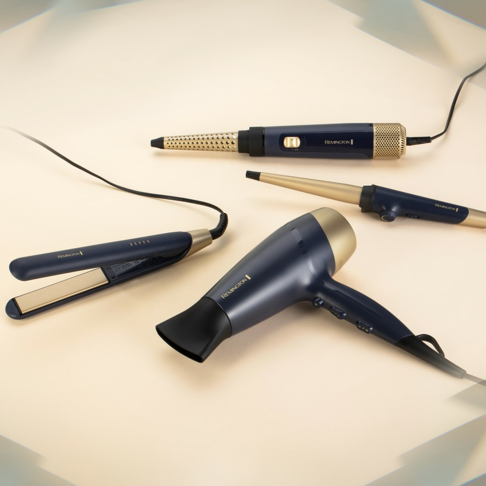 Narzędzia do stylizacji włosów: prostownica, lokówka, lokówka i suszarka do włosów.