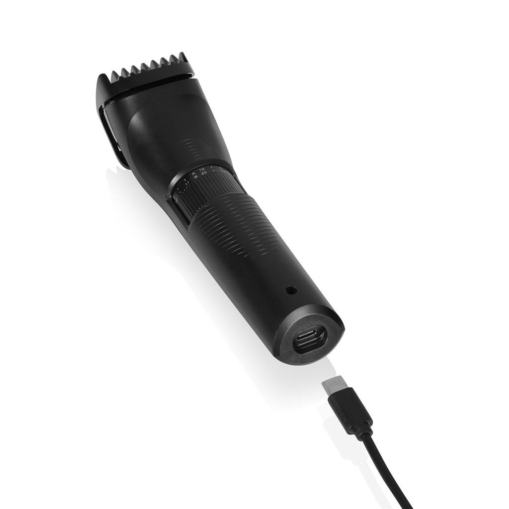 Trimmer per barba nero con caricatore collegato. Il caricatore è scollegato.