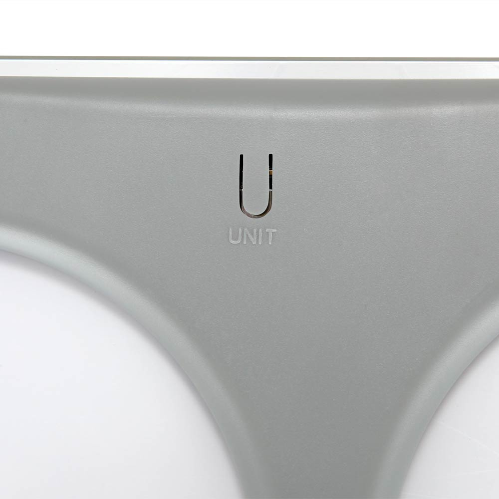 Szare urządzenie z zakrzywionym designem i literą 'U' z napisem UNIT poniżej.