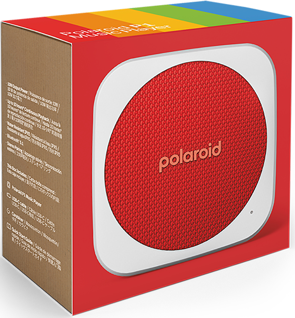 Ein roter Polaroid-Musik-Player in einer Box. Der Lautsprecher hat einen weißen Rand und der Markenname ist sichtbar.