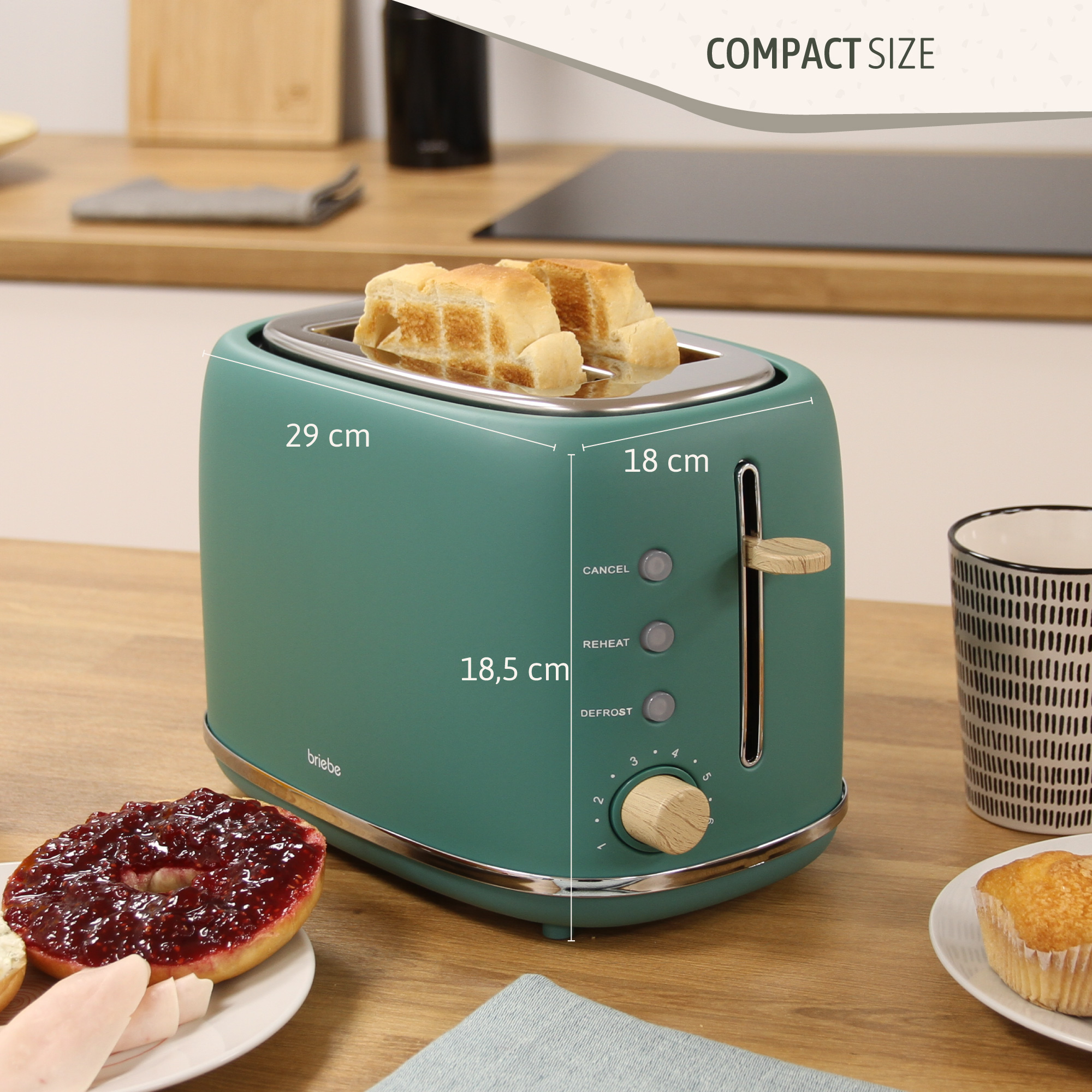 Grüner Toaster mit Maßen, Brot im Inneren und Seitenansicht eines Granatapfels.