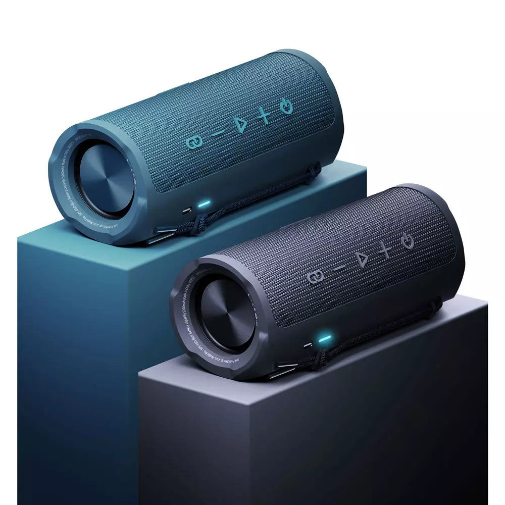 Dwa niebieskie i czarne głośniki cylindryczne na niebieskich i czarnych platformach. Widoczne regulatory głośności i zasilania.