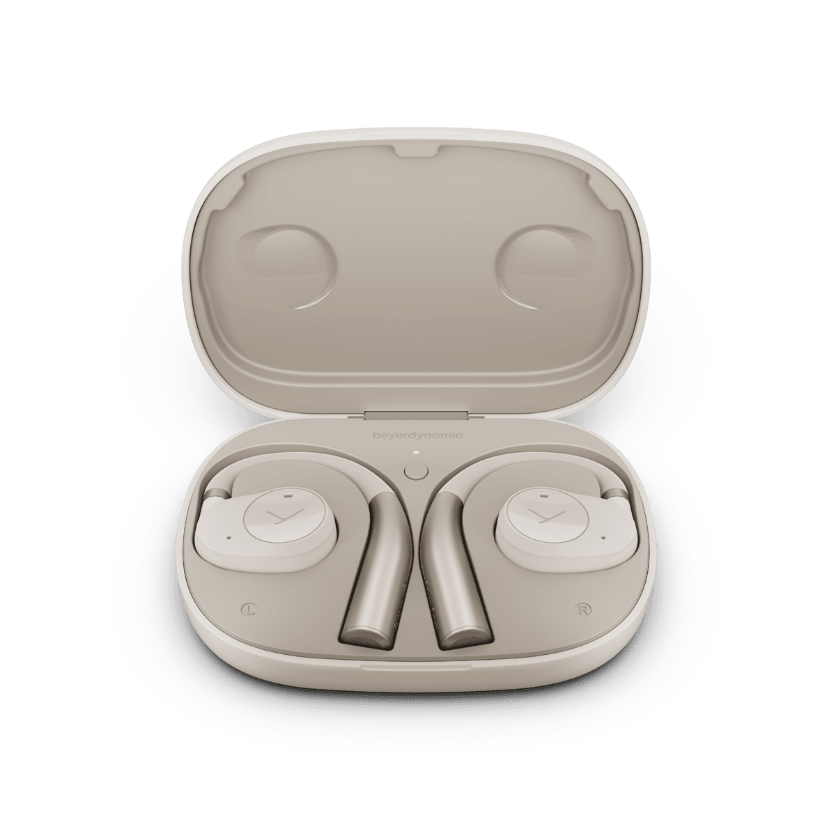 Słuchawki douszne w otwartym etui. Słuchawki są jasno-beżowe, etui również.