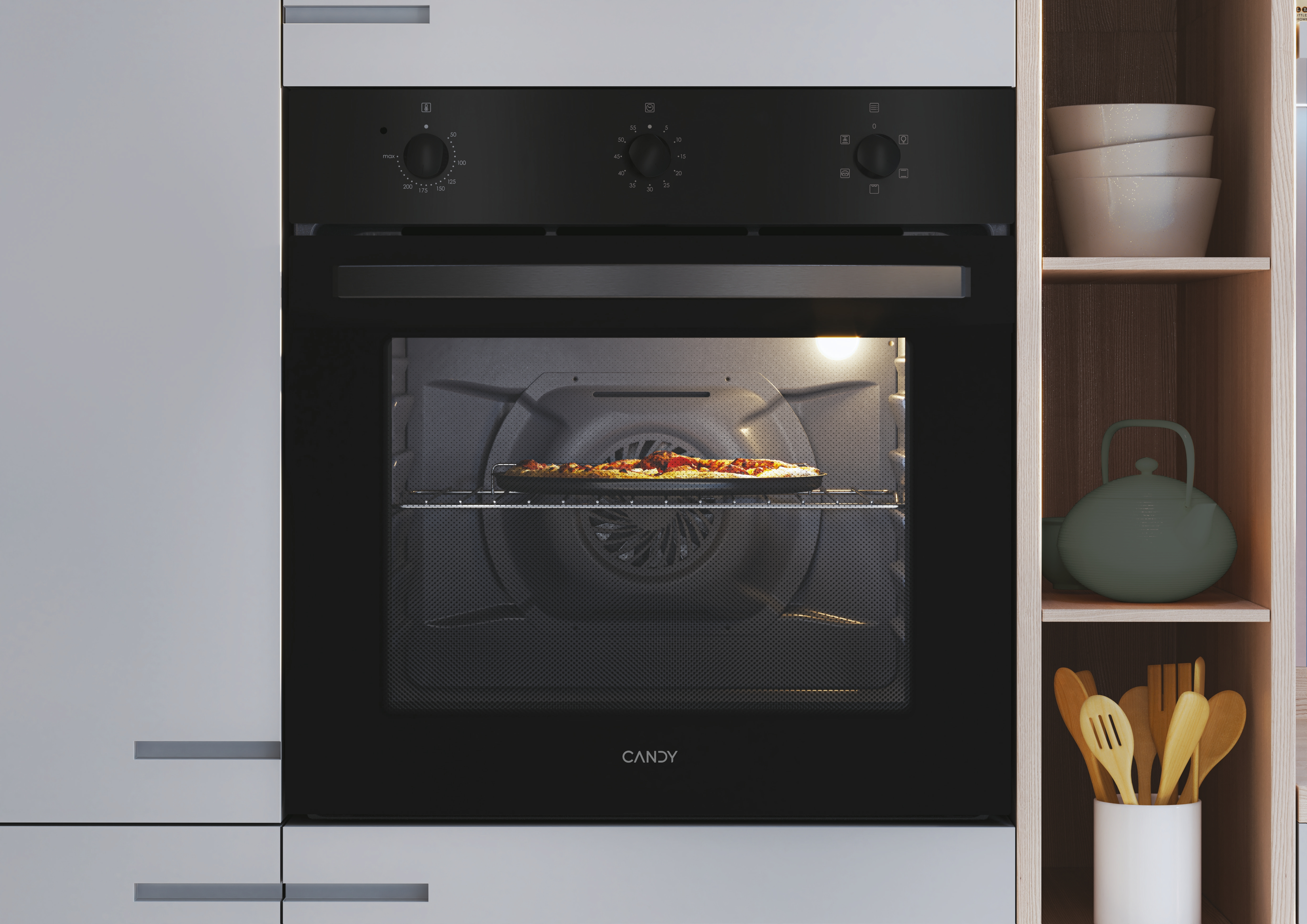 Una cucina con forno a incasso. Il forno è argento, con piano di lavoro nero.