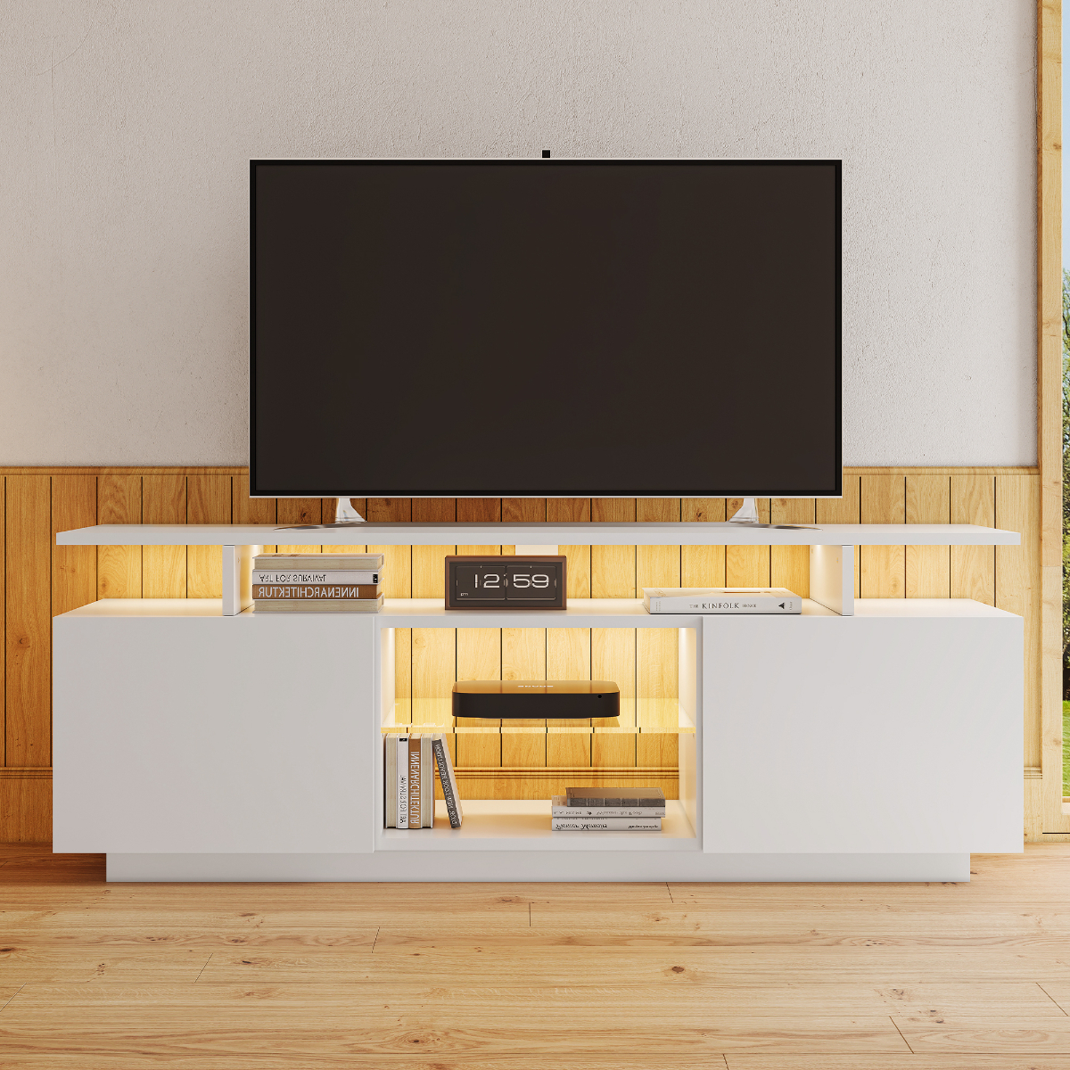 Weißer TV-Ständer mit TV oben. Merkmale sind Beleuchtung, Bücher und eine Uhr.