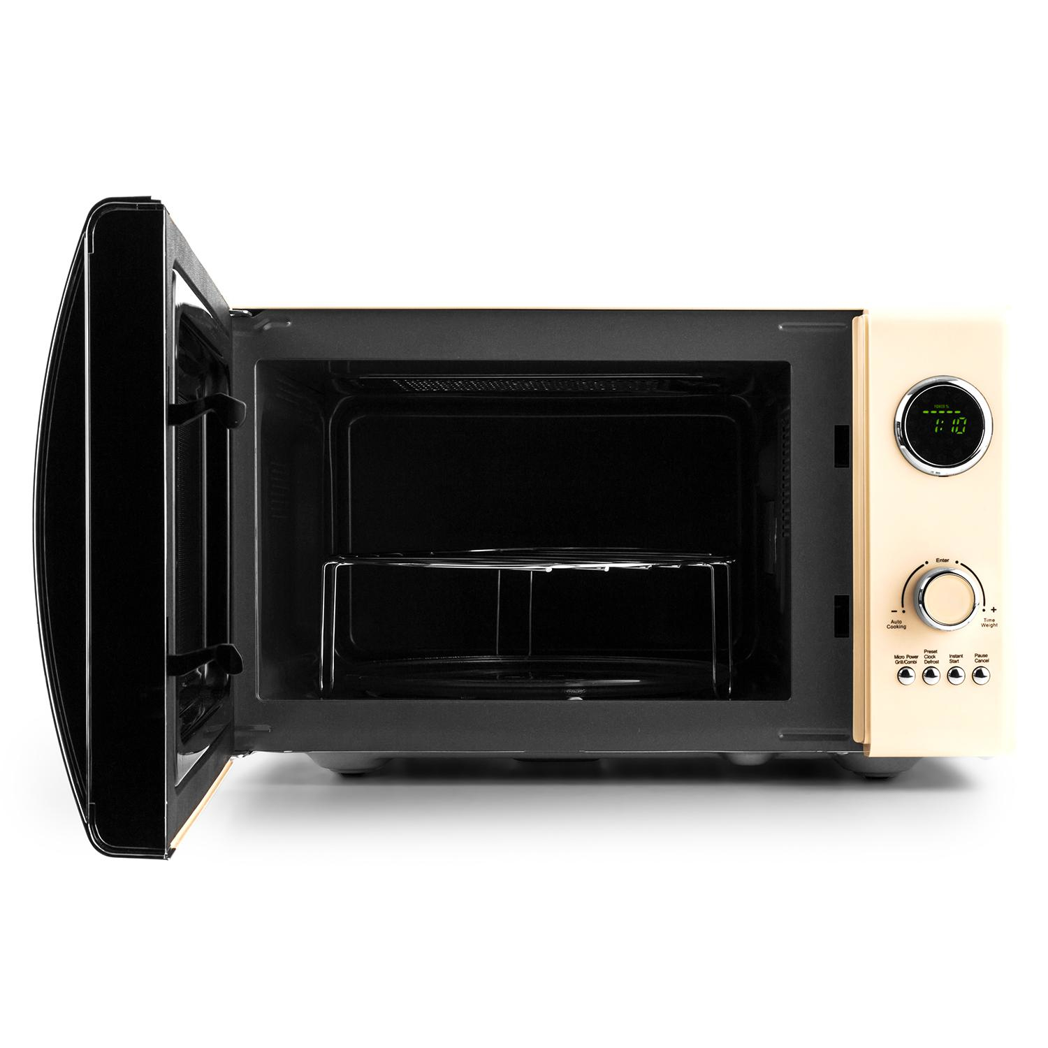 Horno microondas abierto. El interior está vacío, con una bandeja de vidrio y panel de control a la derecha.