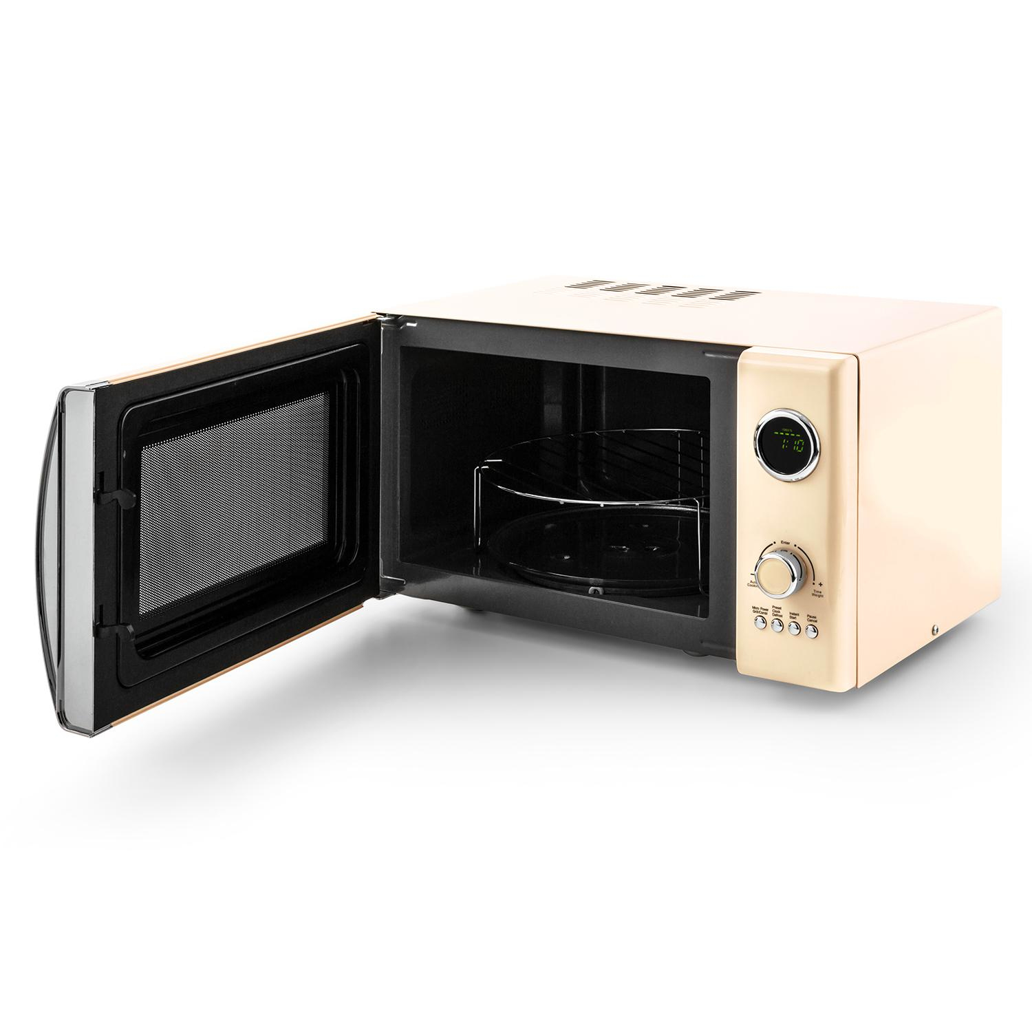 Horno microondas beige con la puerta abierta, mostrando el interior con una rejilla metálica y pantalla digital.