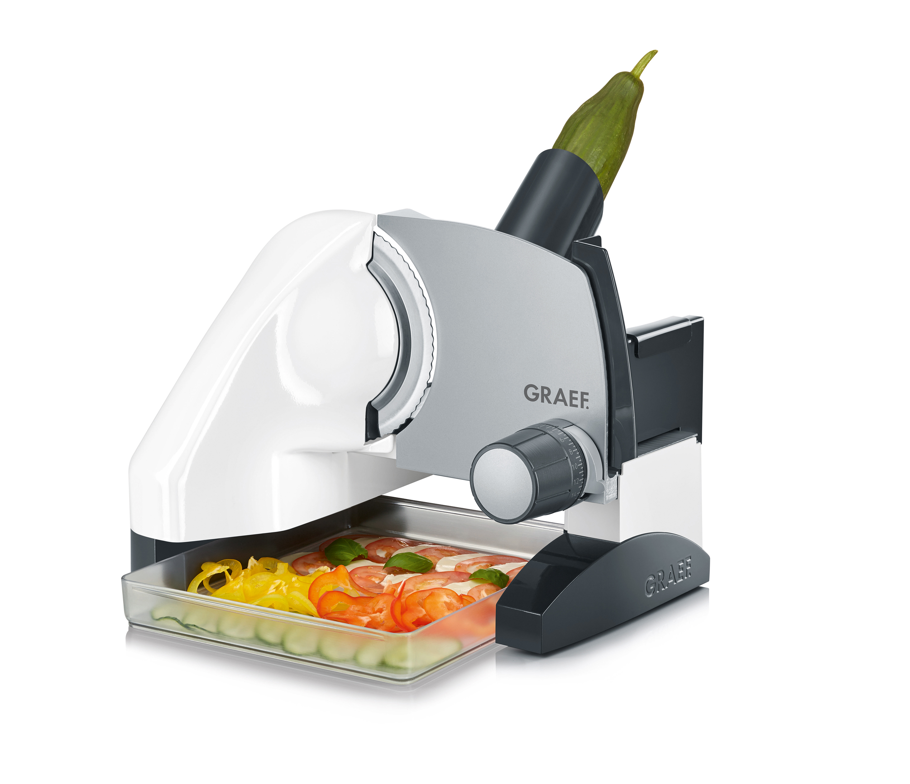 Biało-szara krajalnica do żywności z ogórkiem i pokrojonymi warzywami w tacy.